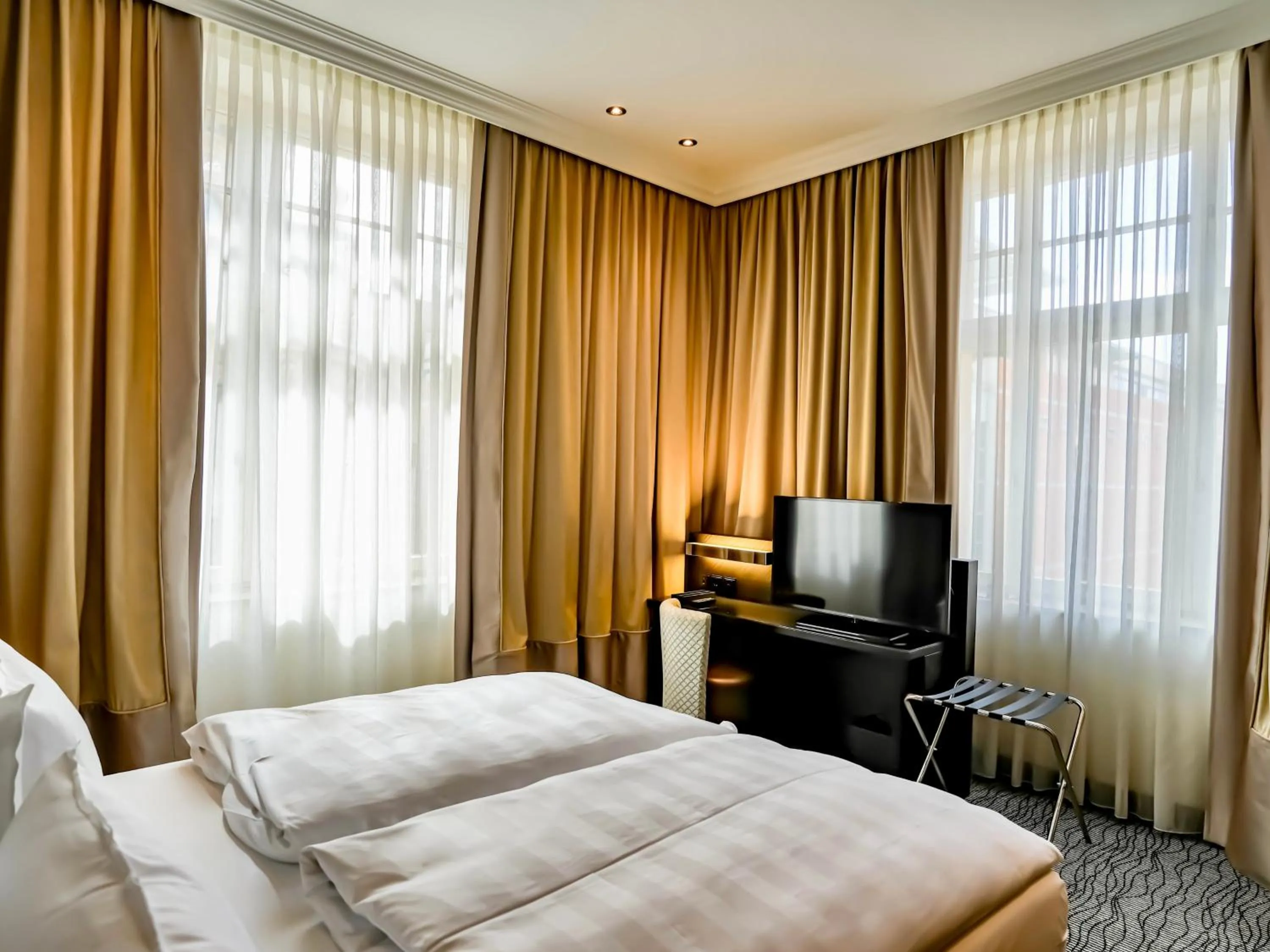 Bed in Steigenberger Icon Grandhotel Handelshof Leipzig