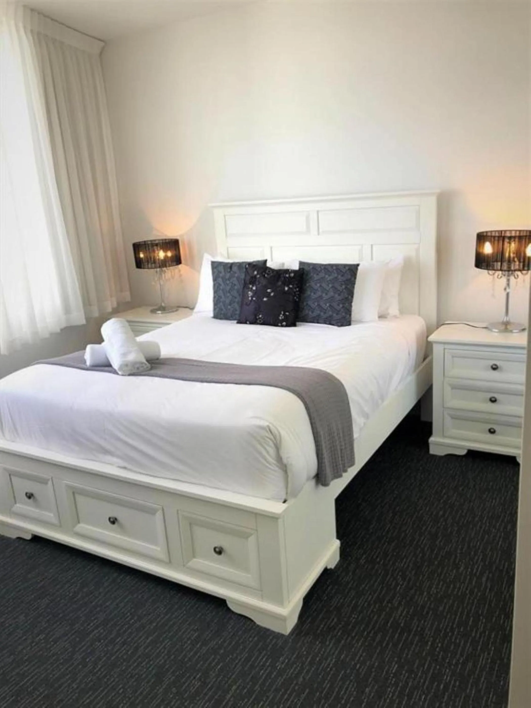 Bed in Tweed Ultima Apartments