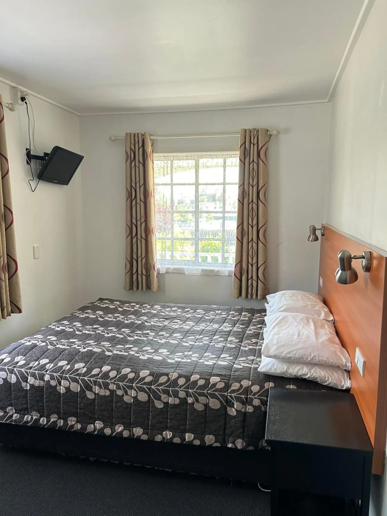 Bed in Tudor Motor Lodge