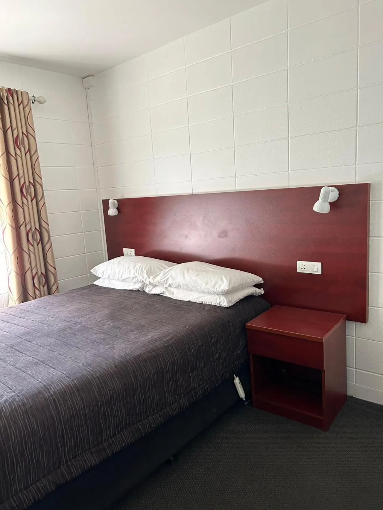 Bed in Tudor Motor Lodge