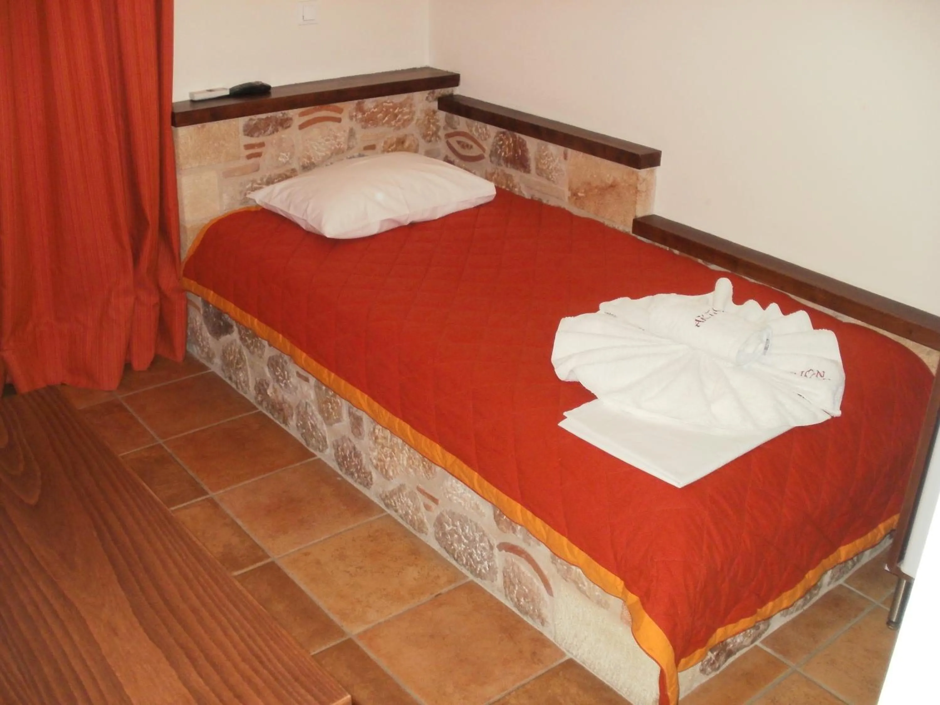 Bed in Aktaion Hotel