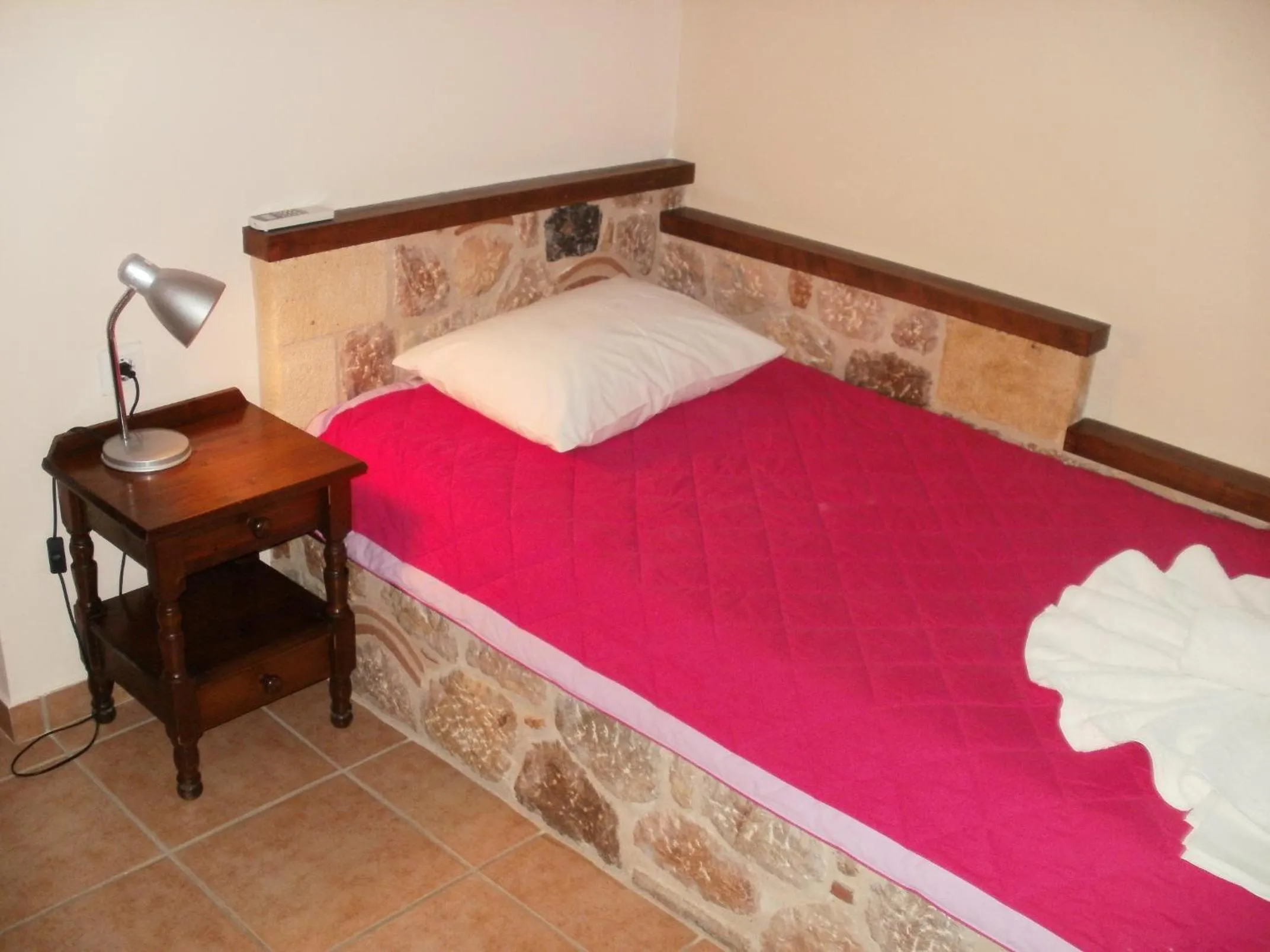 Bed in Aktaion Hotel