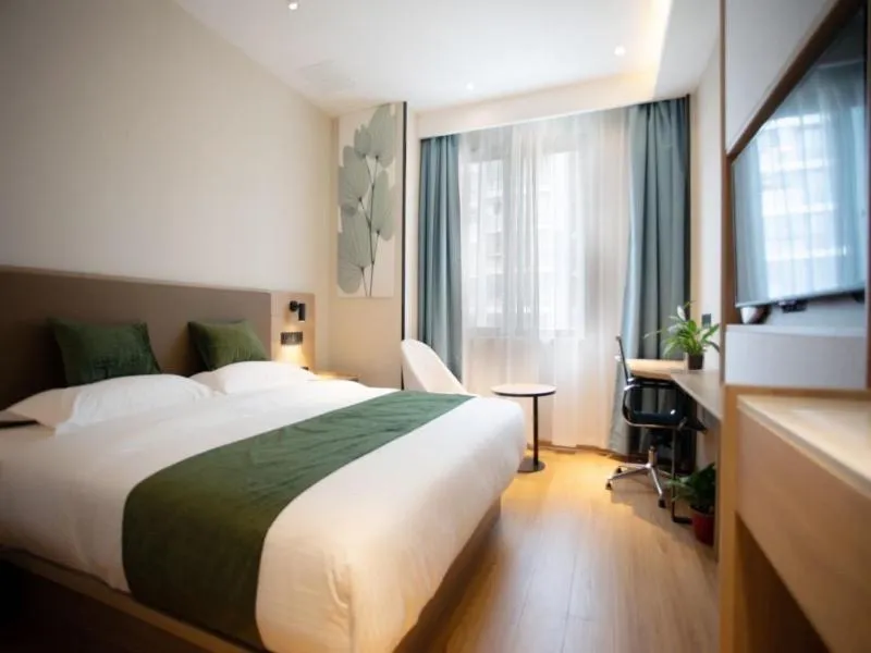 Bed in GreenTree Inn Suzhou Industrial Park Shengpu Town Xinsheng Road Express Hotel