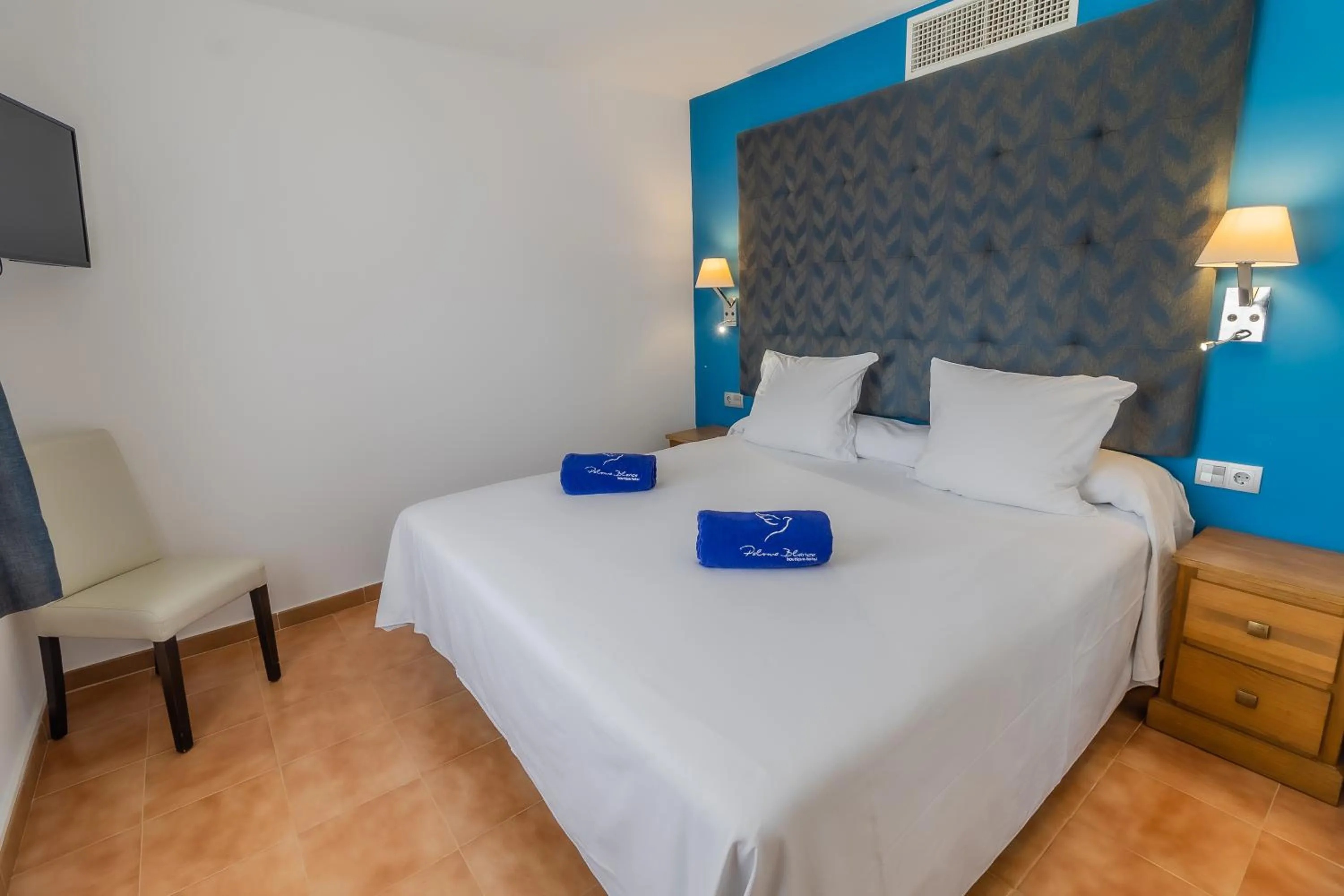 Bed in Paloma Blanca Boutique Hotel