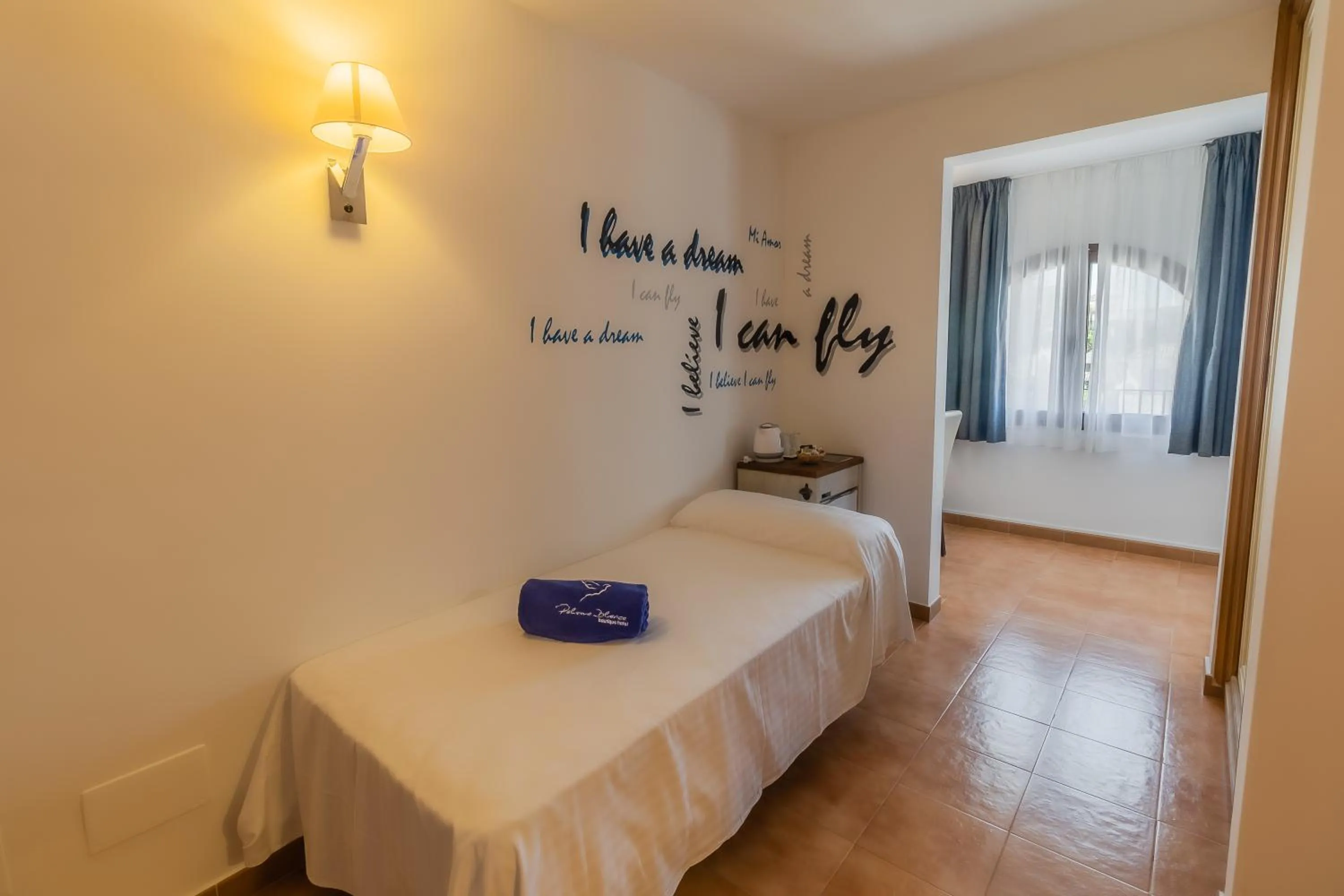 Bed in Paloma Blanca Boutique Hotel