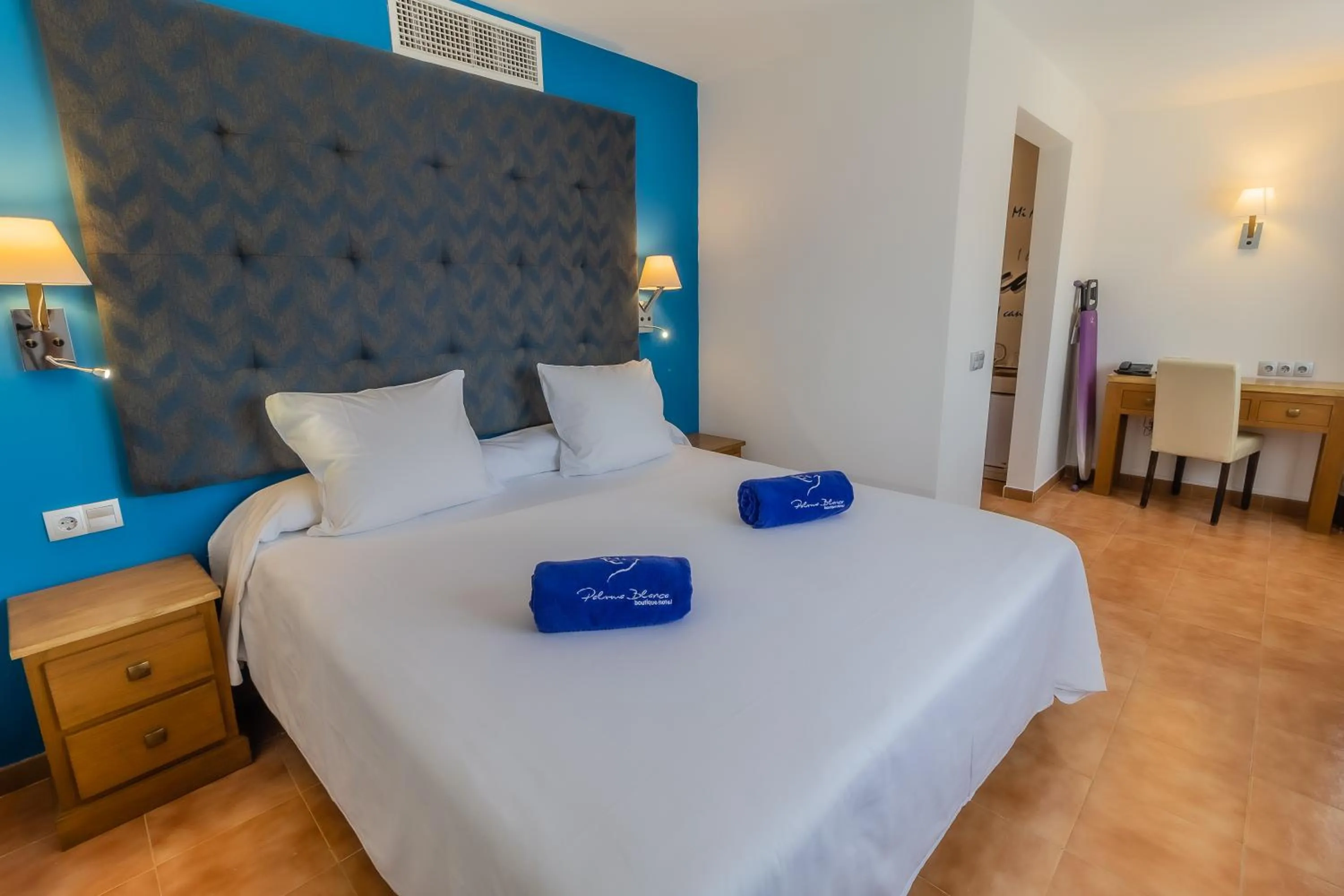 Bed in Paloma Blanca Boutique Hotel