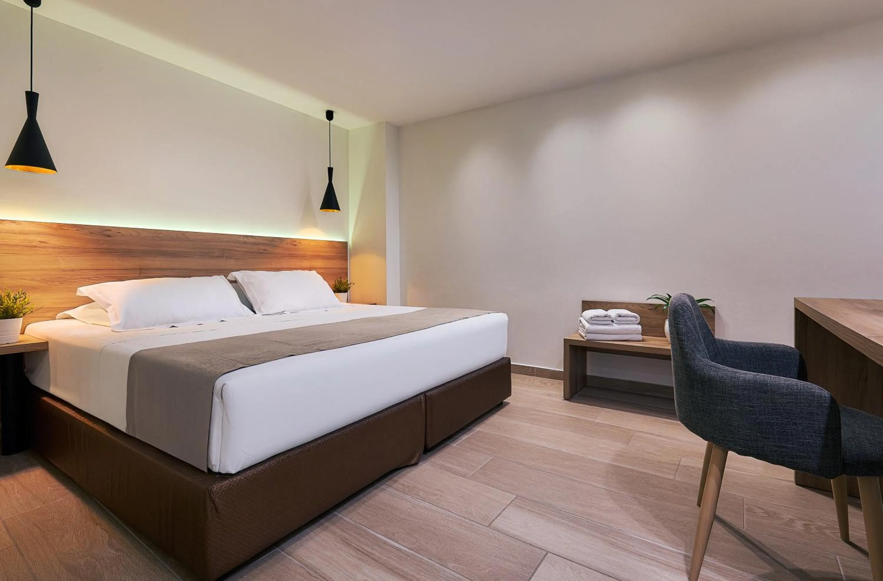 Bed in Dionisos Hotel