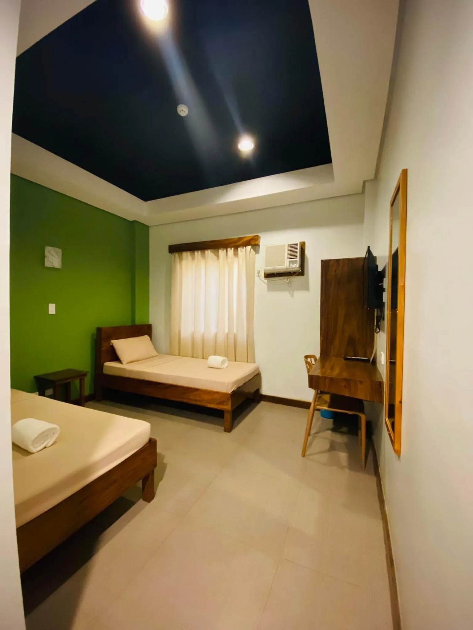 Bed in Acacia Garden Inn and Suites