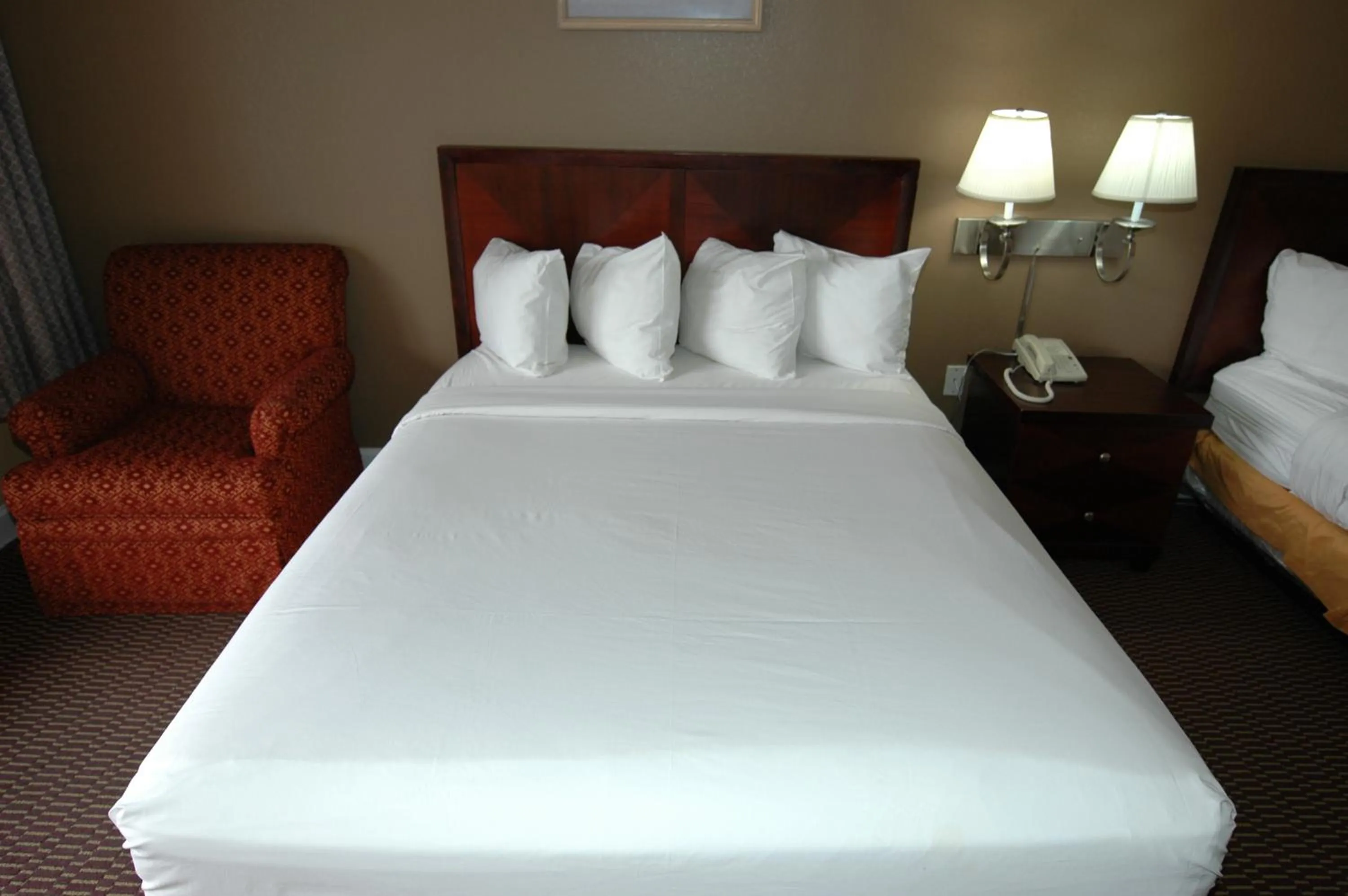 Decorative detail, Bed in Ambassadors Inn & Suites