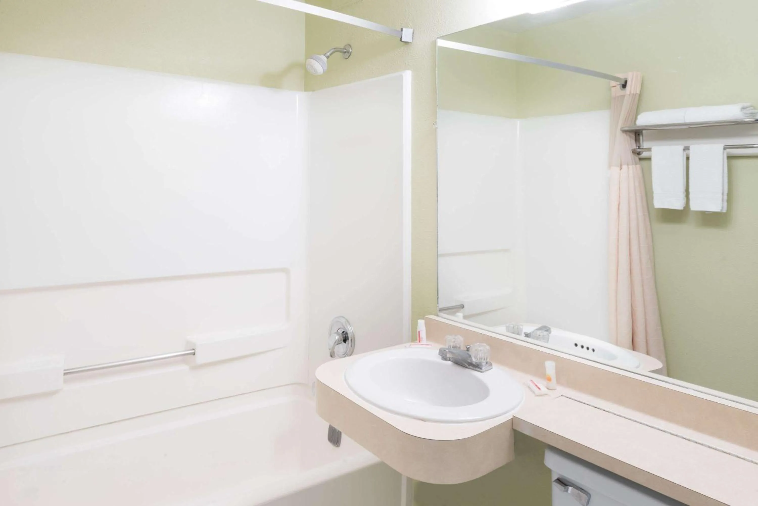 Bathroom in Days Inn by Wyndham Henrietta/Rochester Area