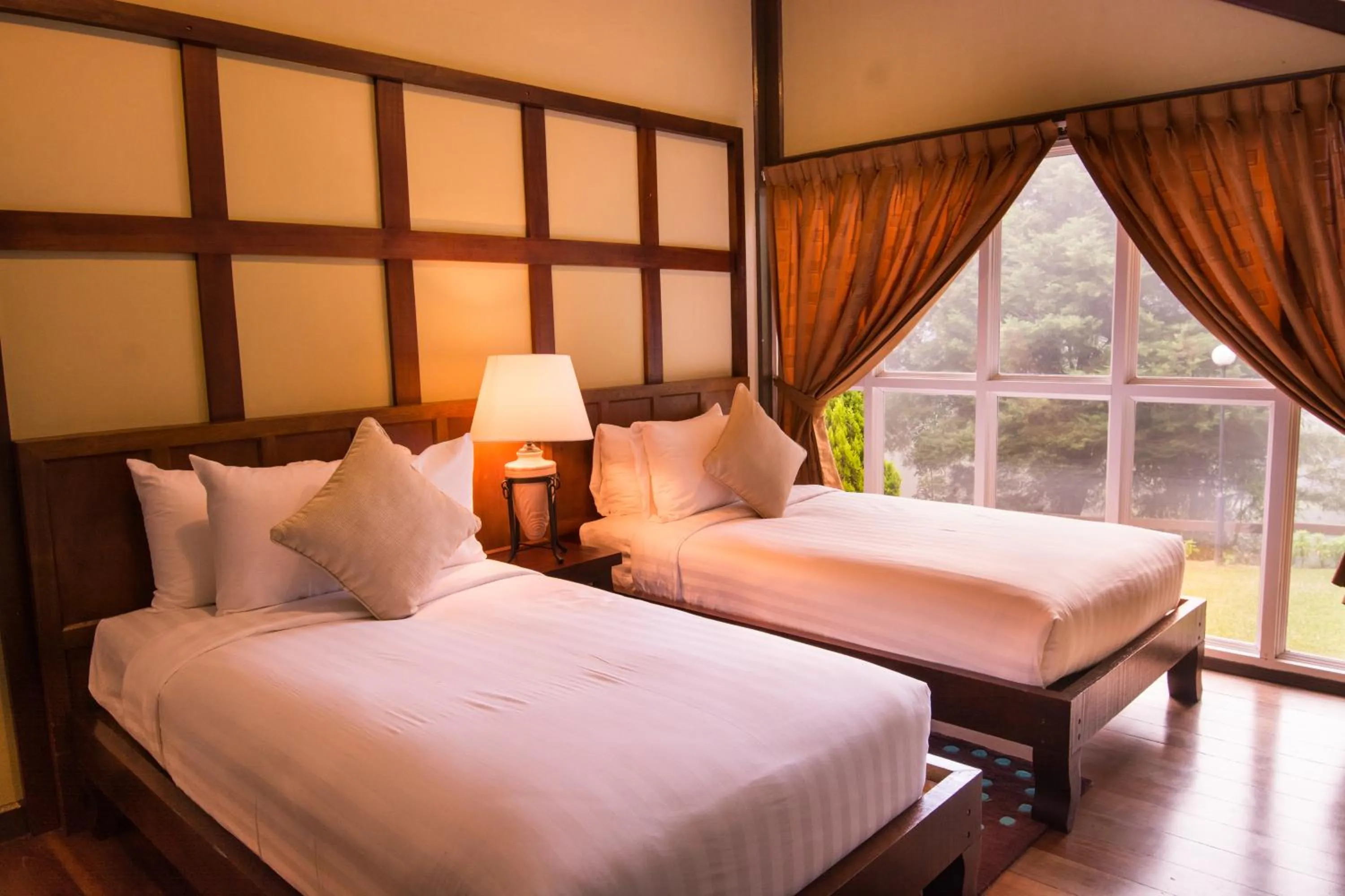 Bed in Sutera Sanctuary Lodges At Kinabalu Park