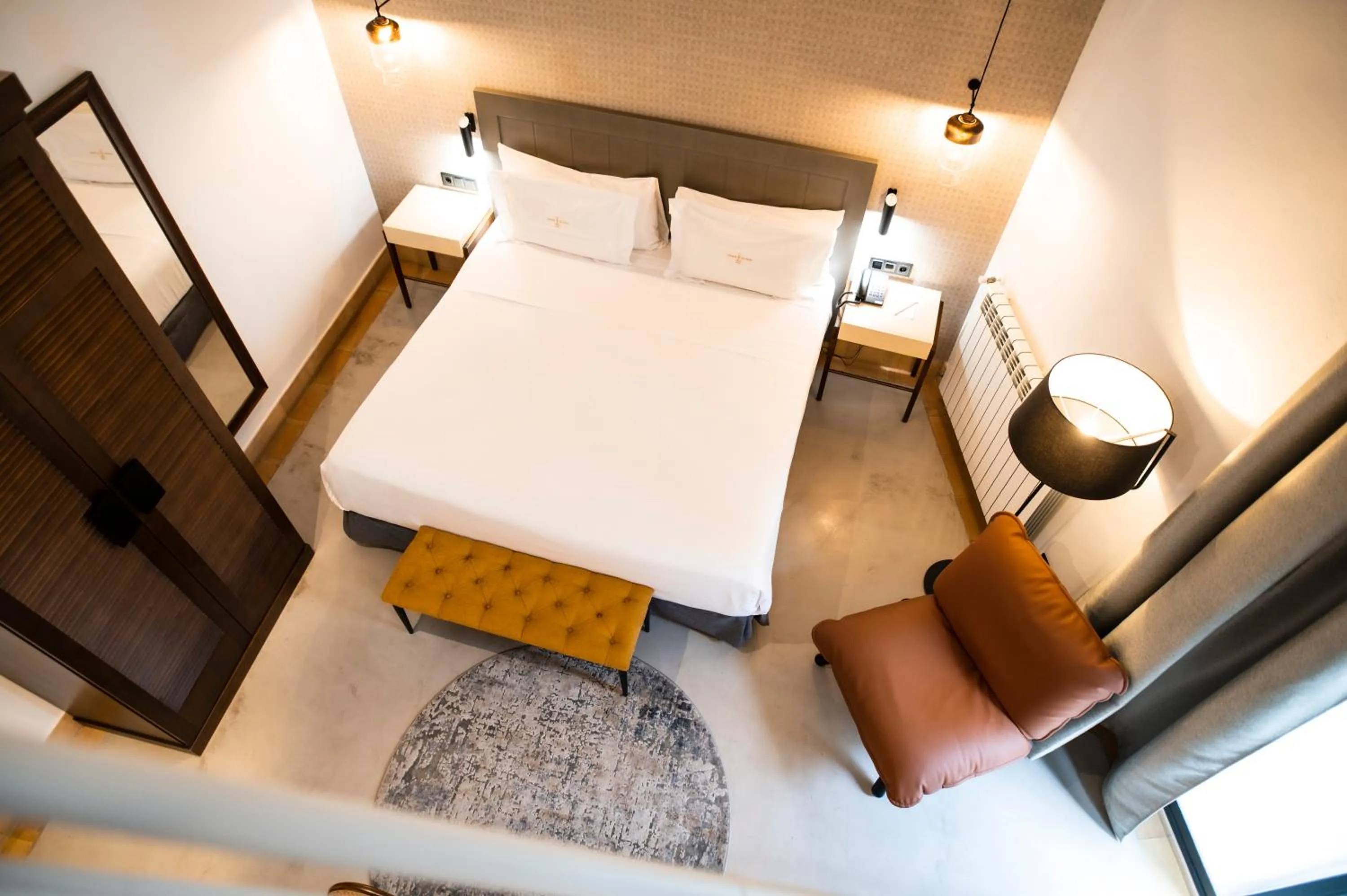 Bed in Legado Alcazar Hotel