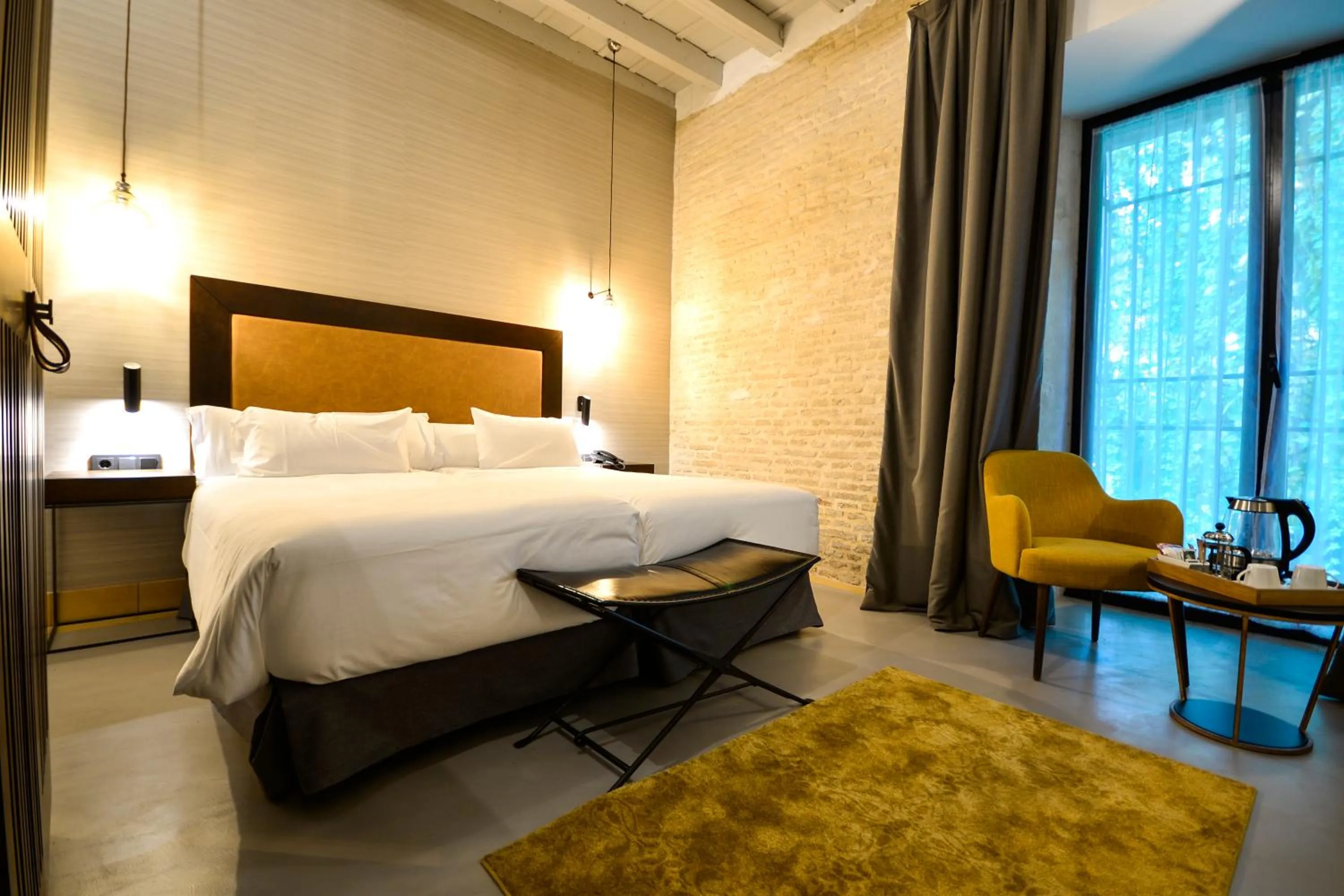 Bed in Legado Alcazar Hotel