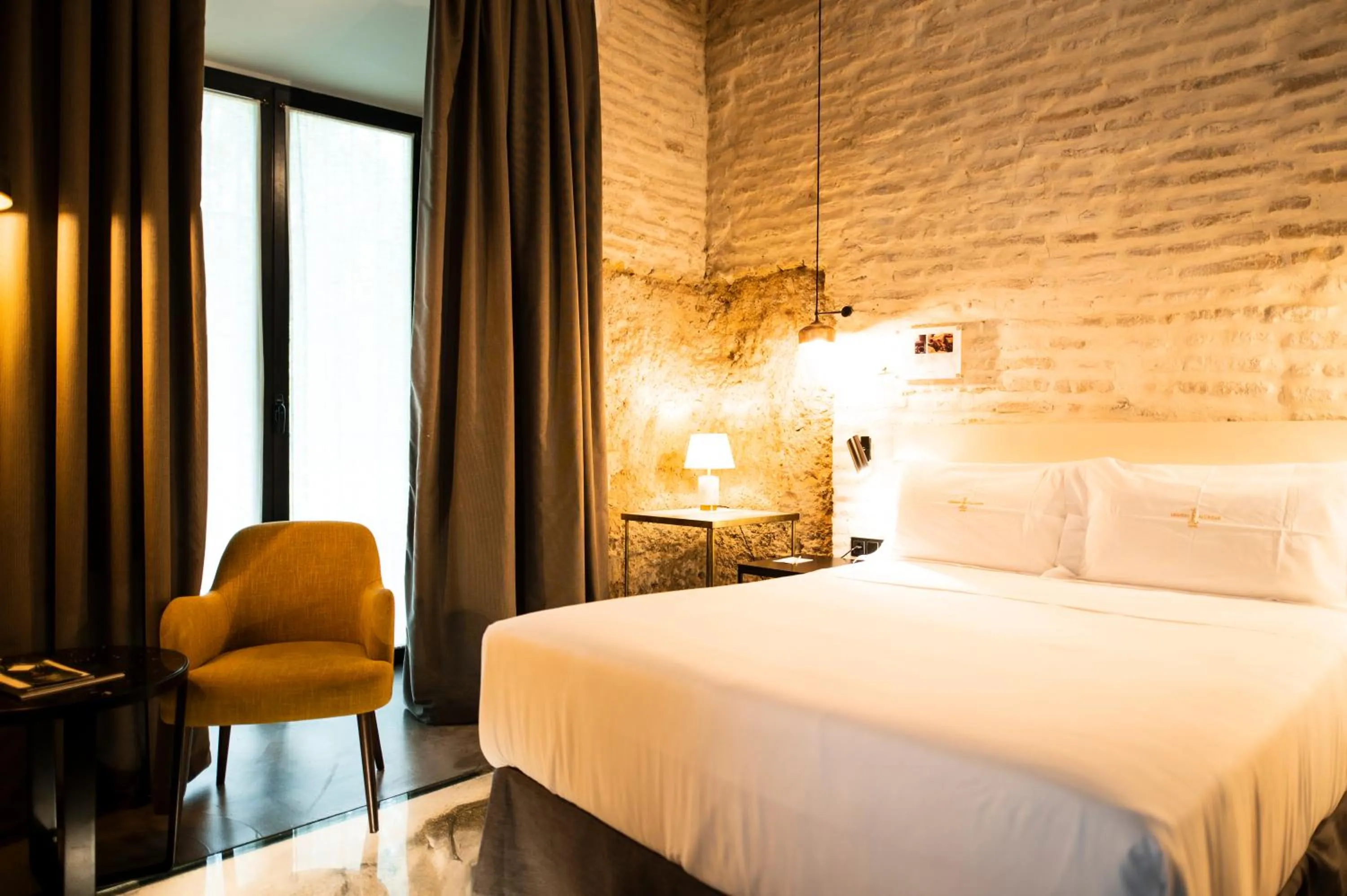 Bed in Legado Alcazar Hotel