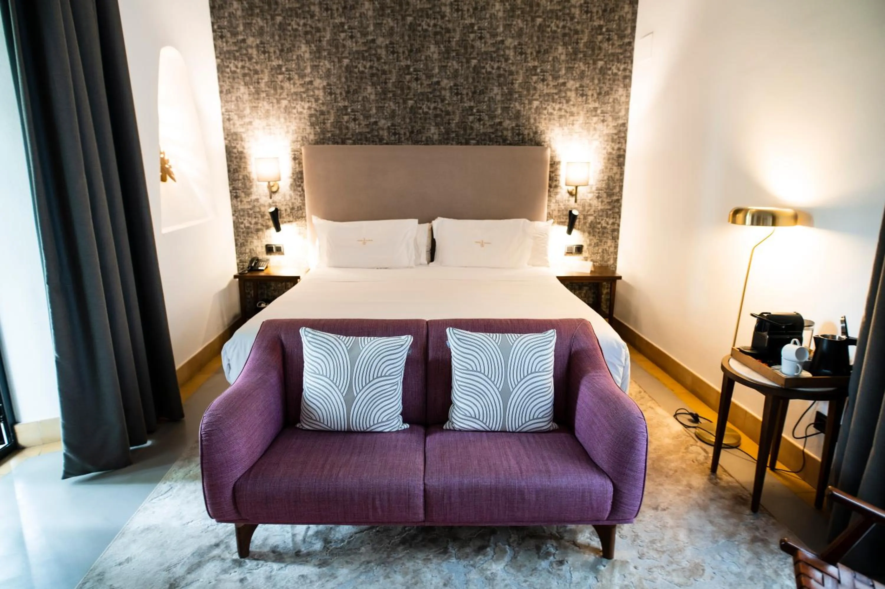 Bed in Legado Alcazar Hotel