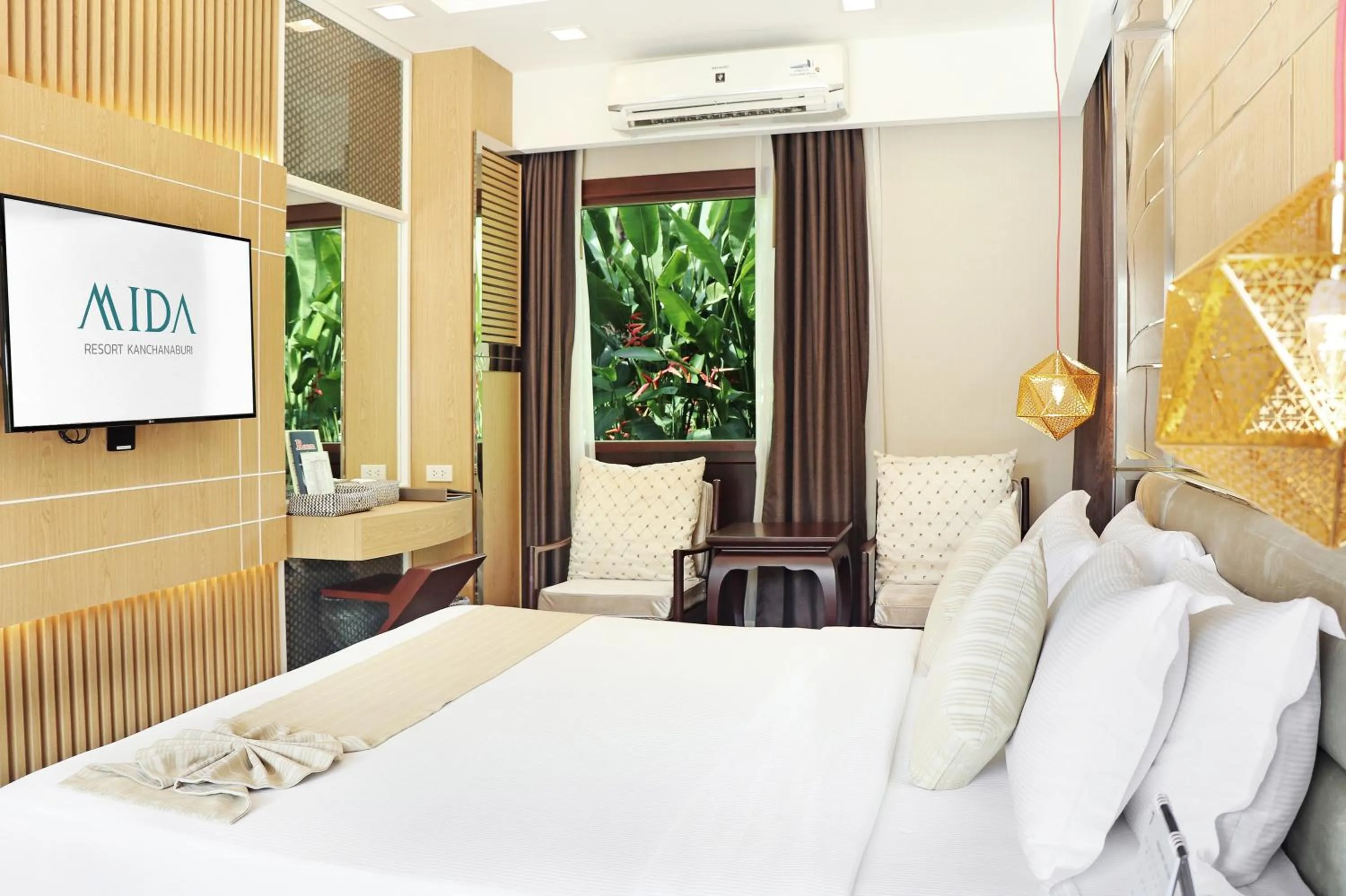 Photo of the whole room, Bed in Mida Resort Kanchanaburi - SHA PLUS