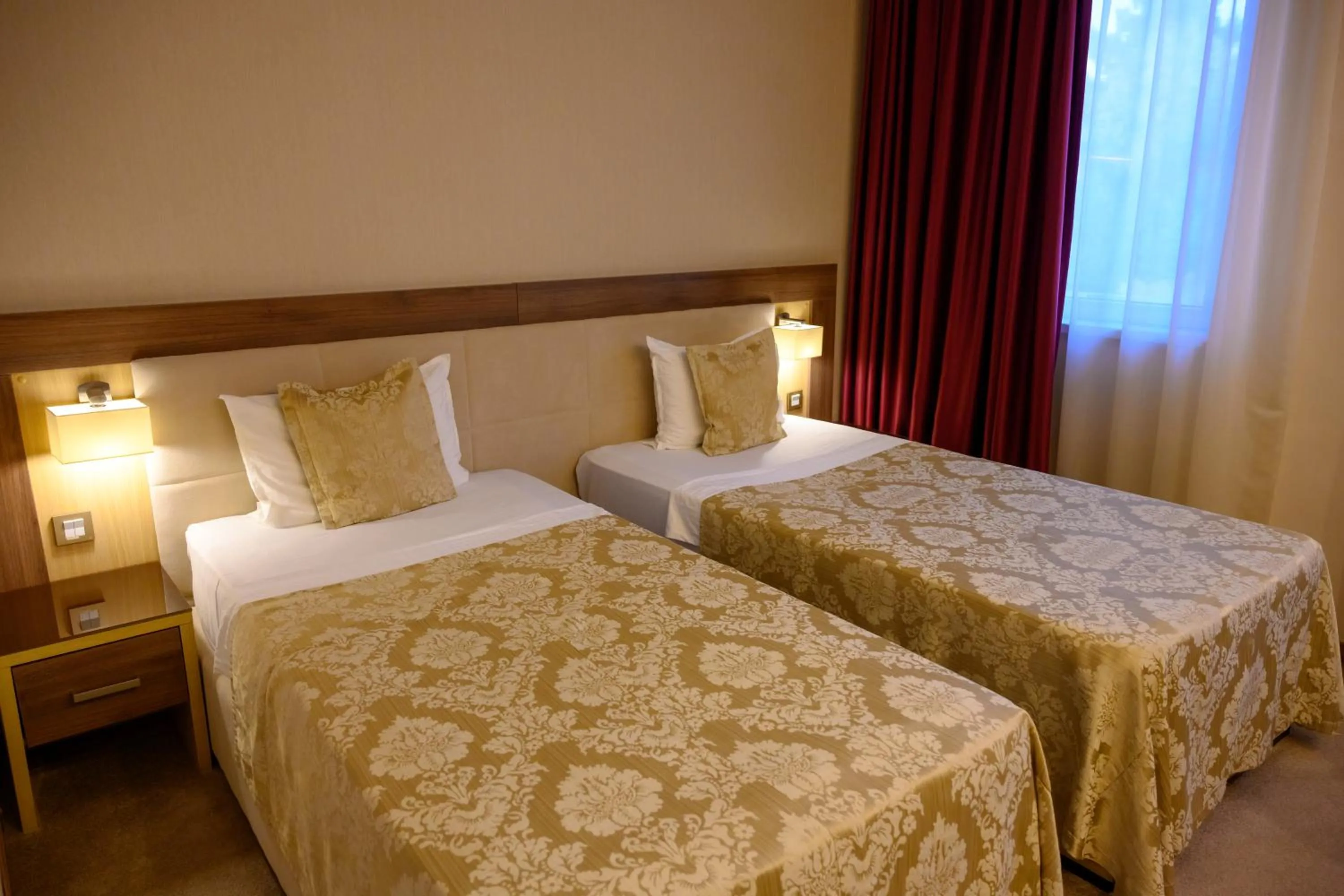 Bed in Hotel Tami Residence