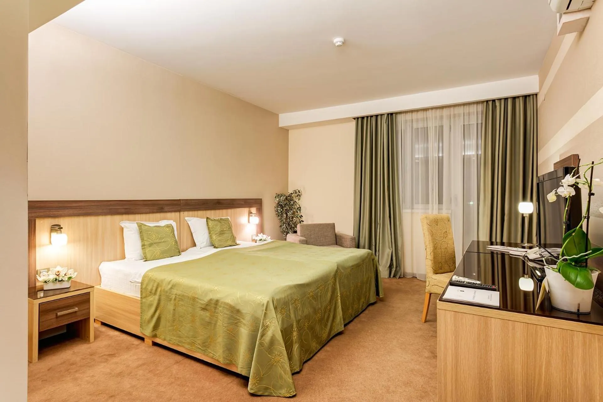 Bed in Hotel Tami Residence