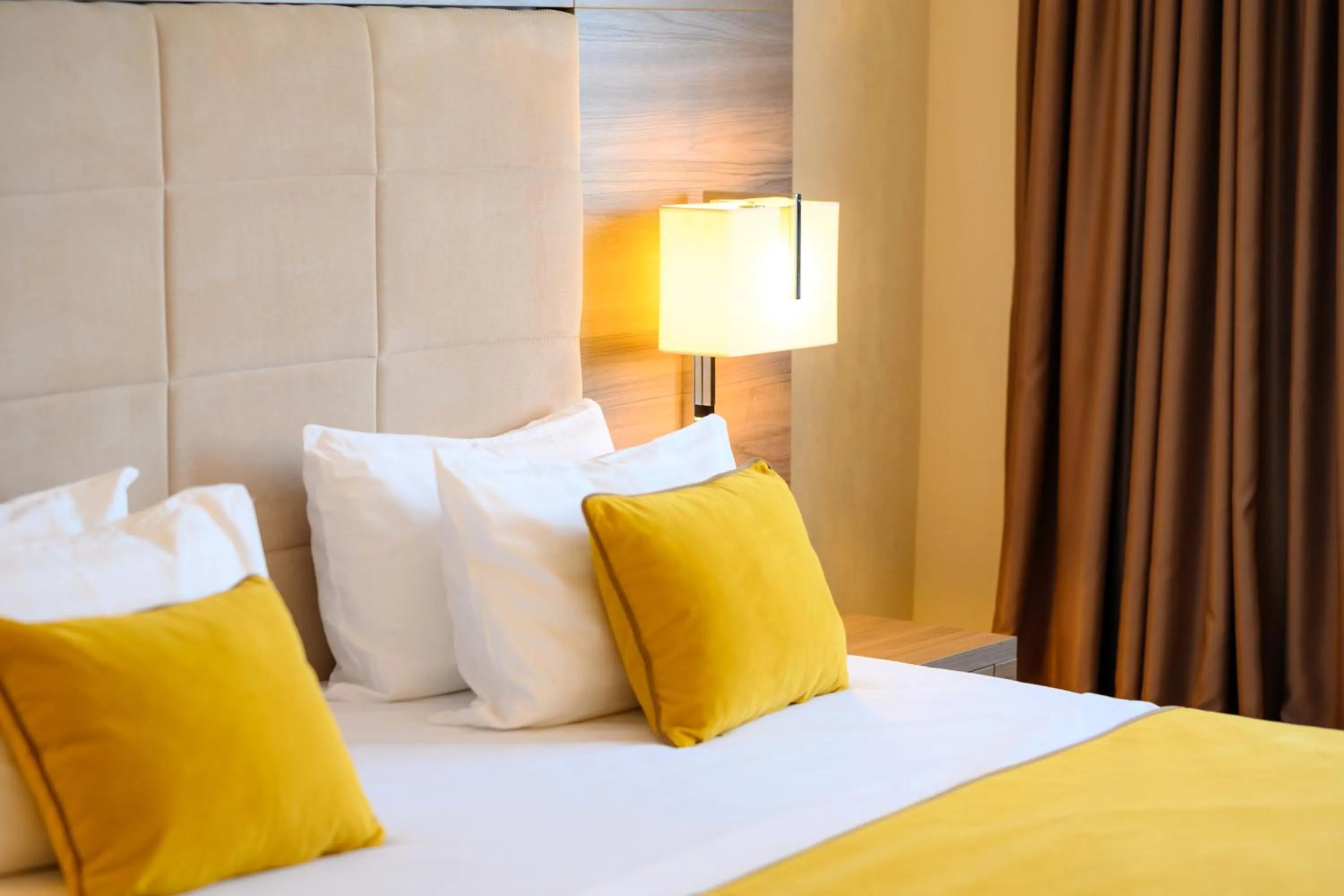 Bed in Hotel Tami Residence