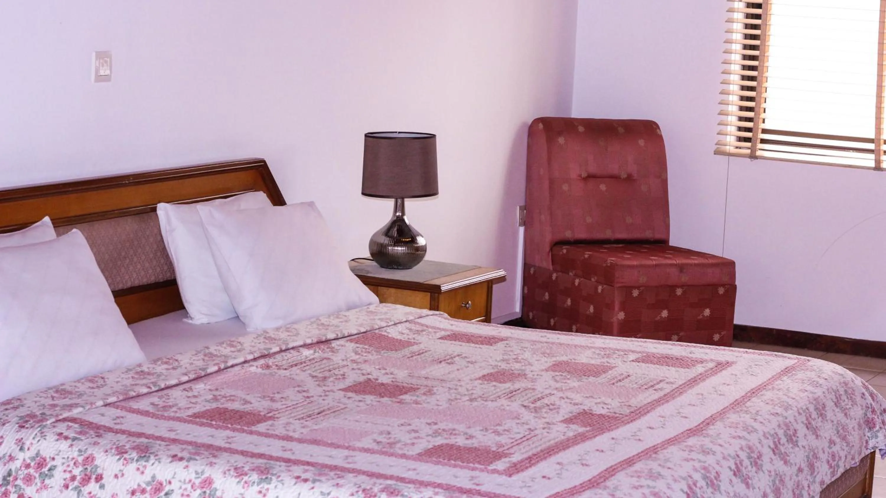 Bed in Lavender Lodge Hotel