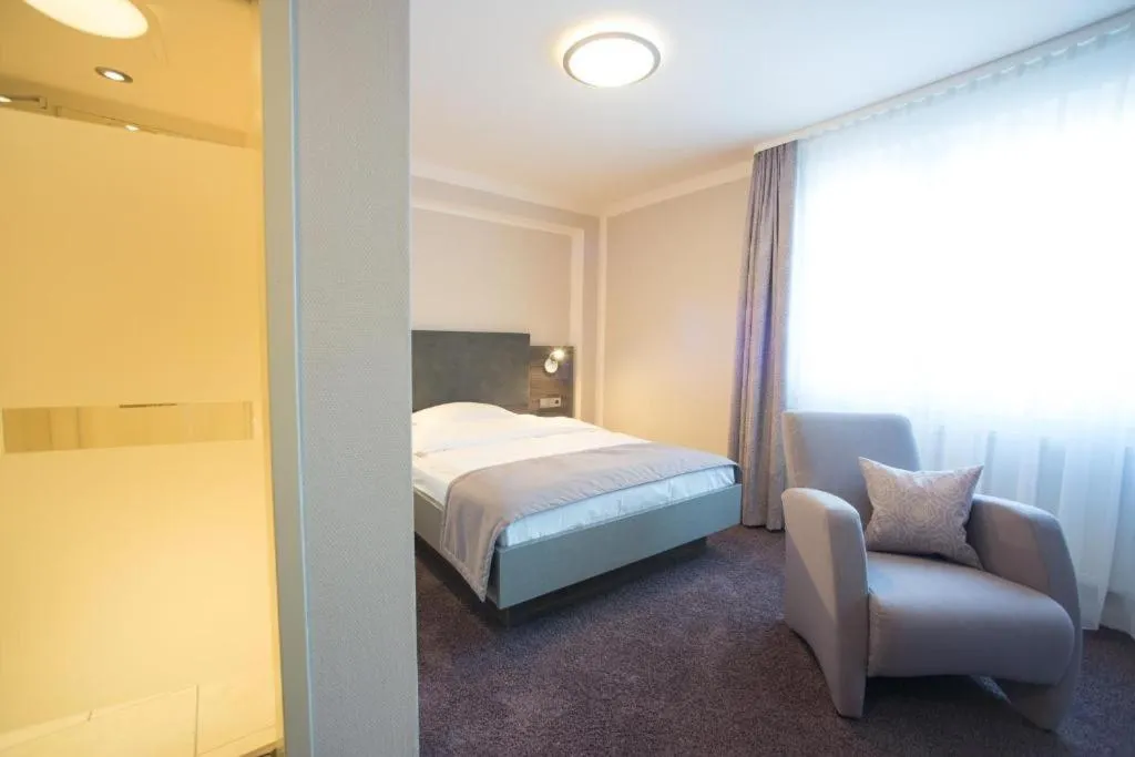 Photo of the whole room, Bed in TRIP INN PostHotel Düren