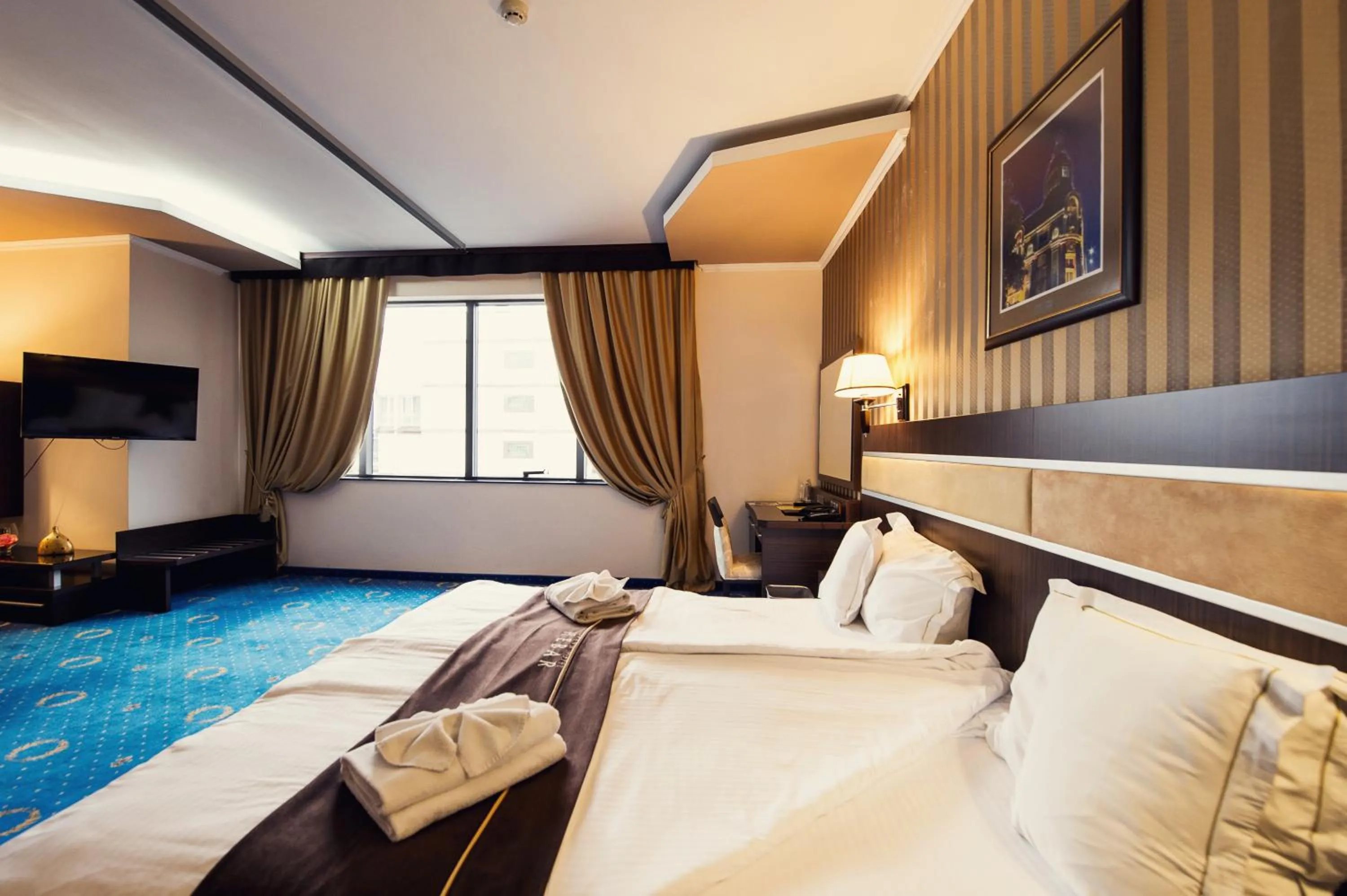 Toilet, Bed in Grand Hotel Hebar