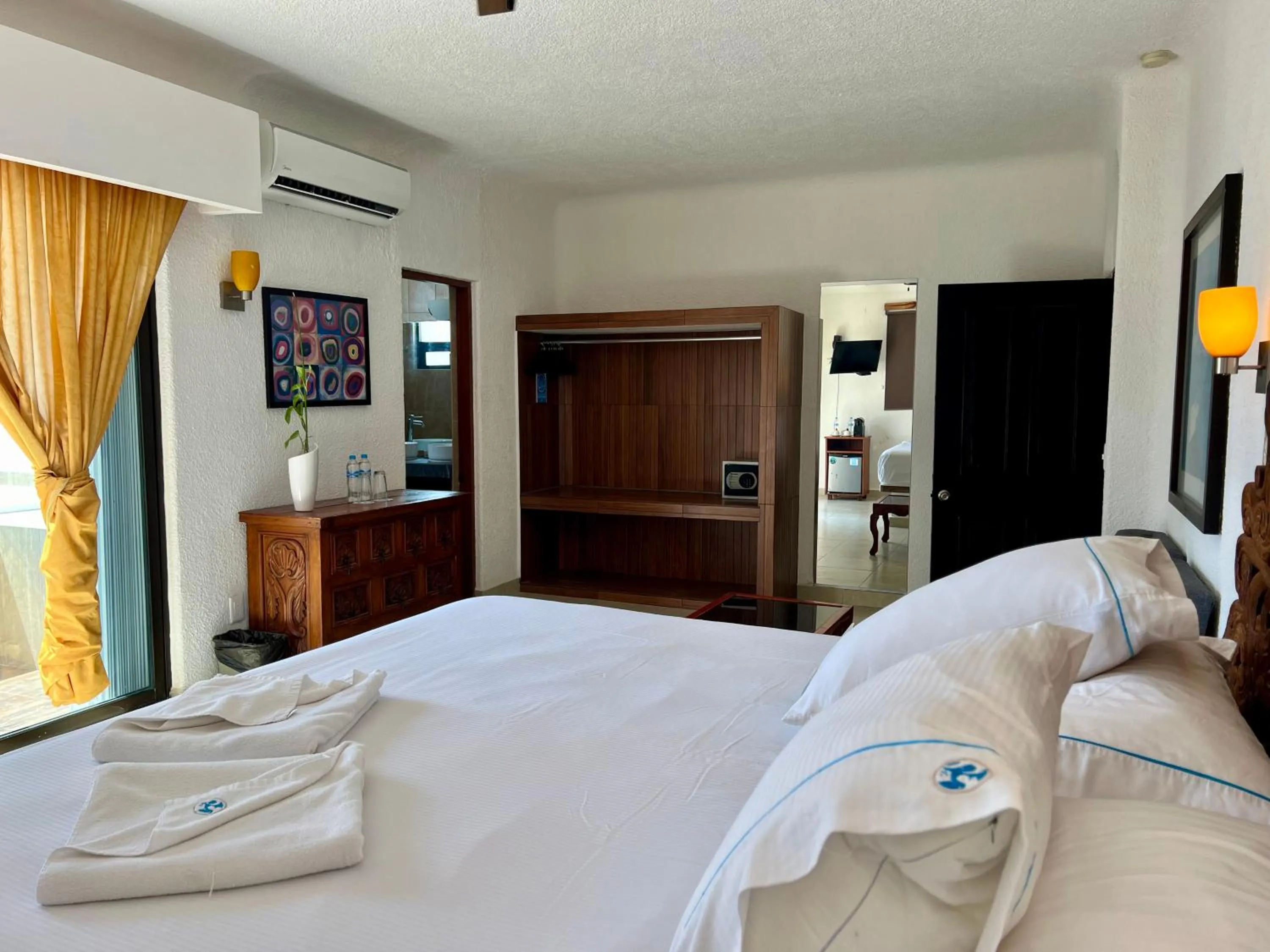 Bed in Pelicano Inn Playa del Carmen - Beachfront Hotel