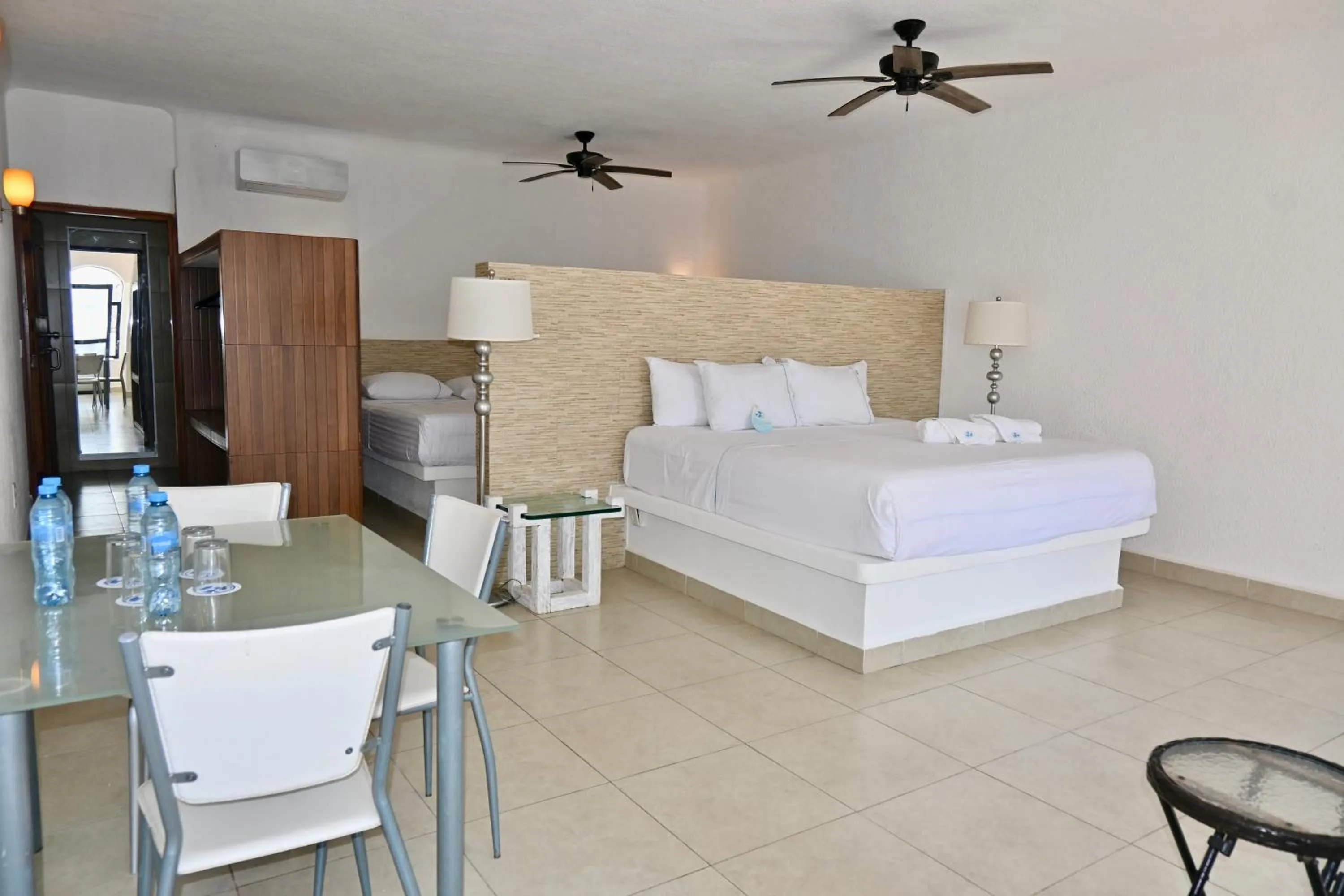 Bed in Pelicano Inn Playa del Carmen - Beachfront Hotel
