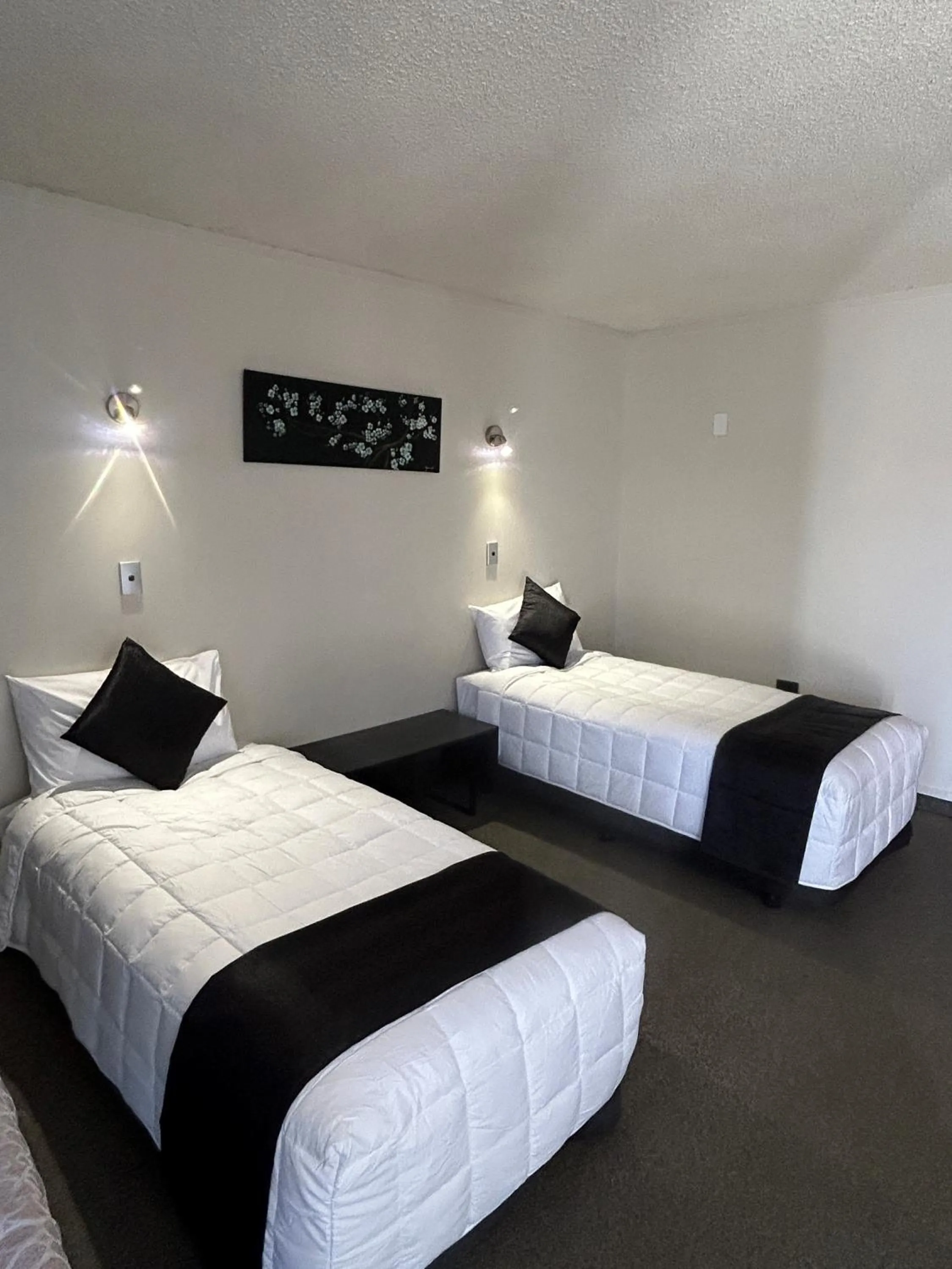 Bed in Aquarius Motor Inn