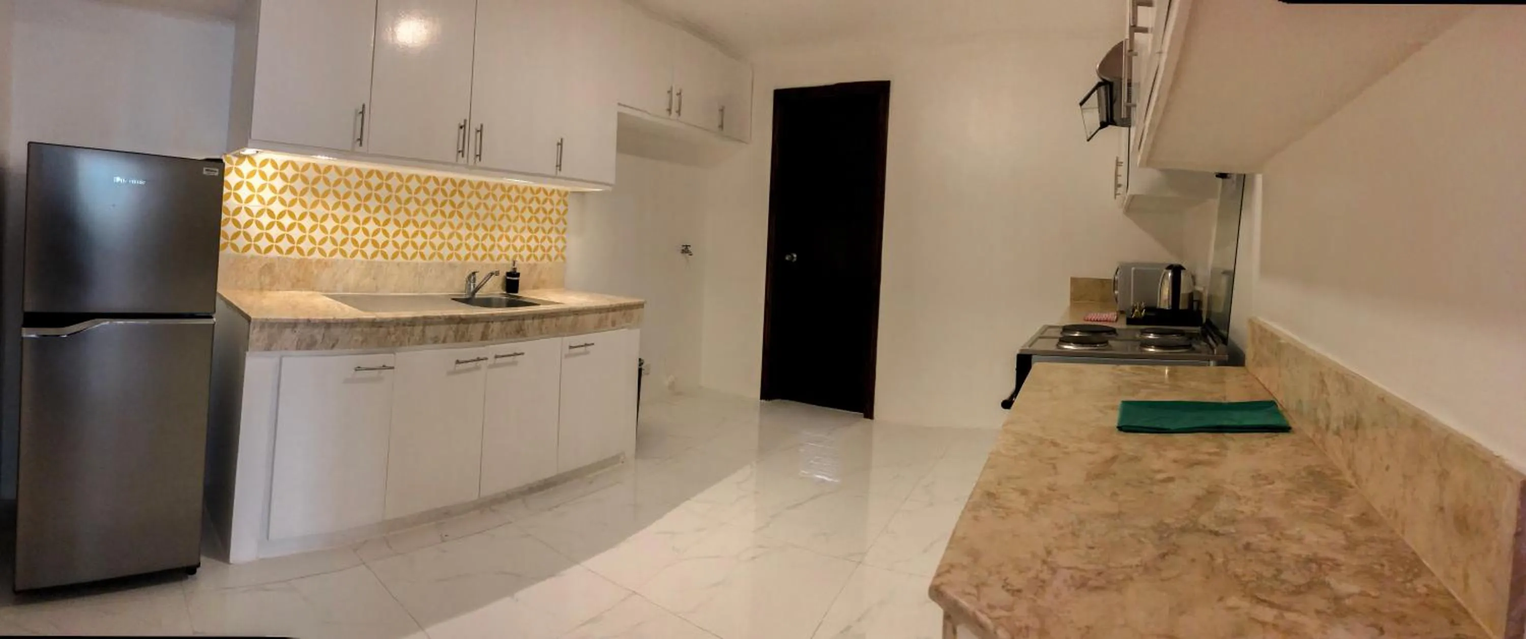 Kitchen or kitchenette in Parque España Residence Hotel