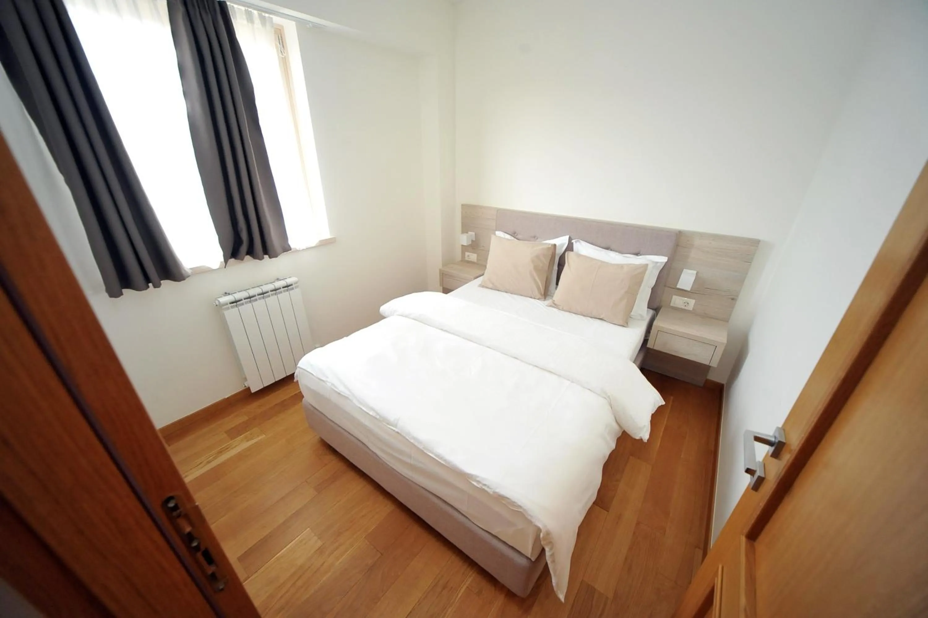 Bed in Vila Apartments Wellness&Spa