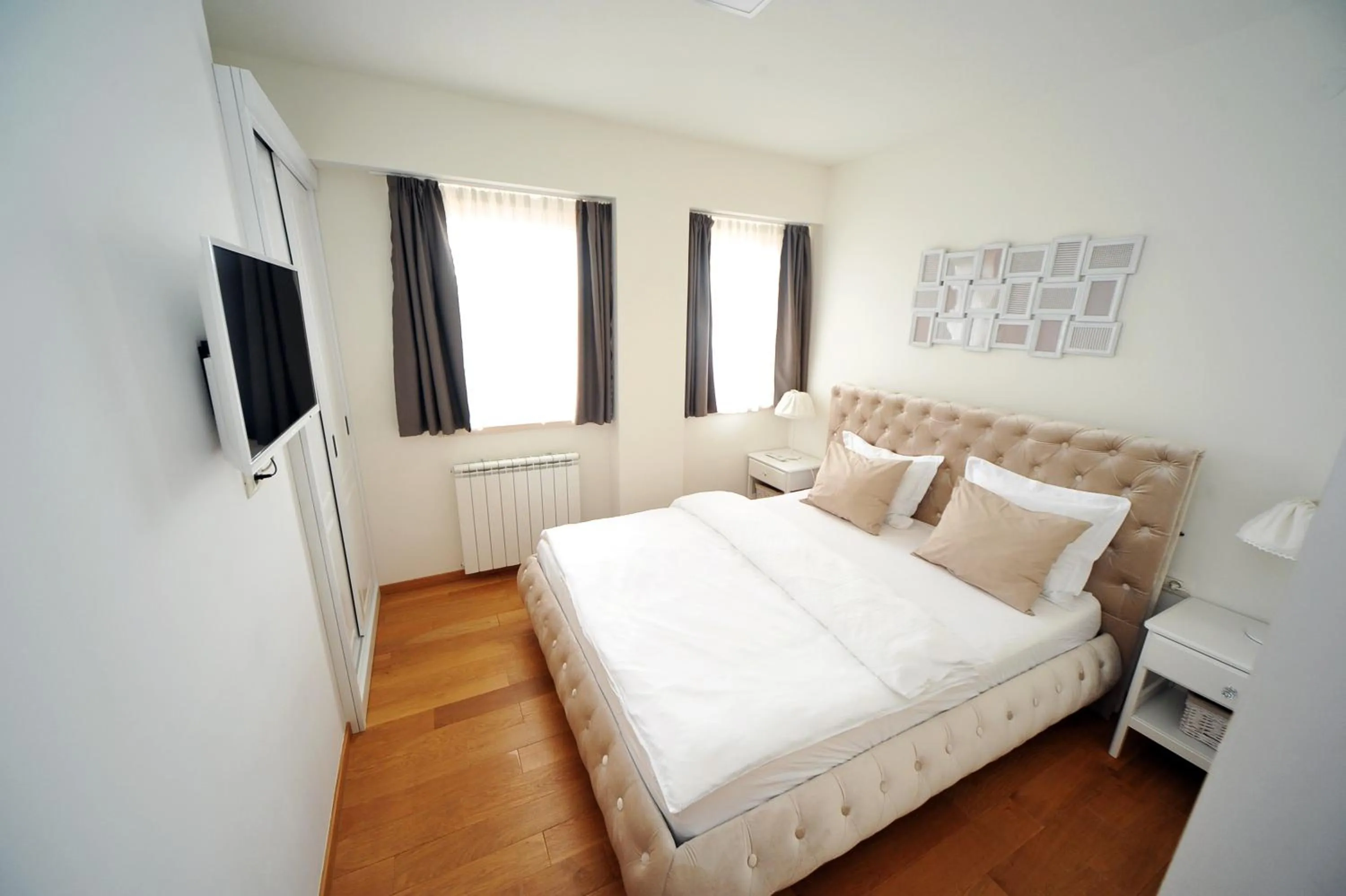 Bed in Vila Apartments Wellness&Spa