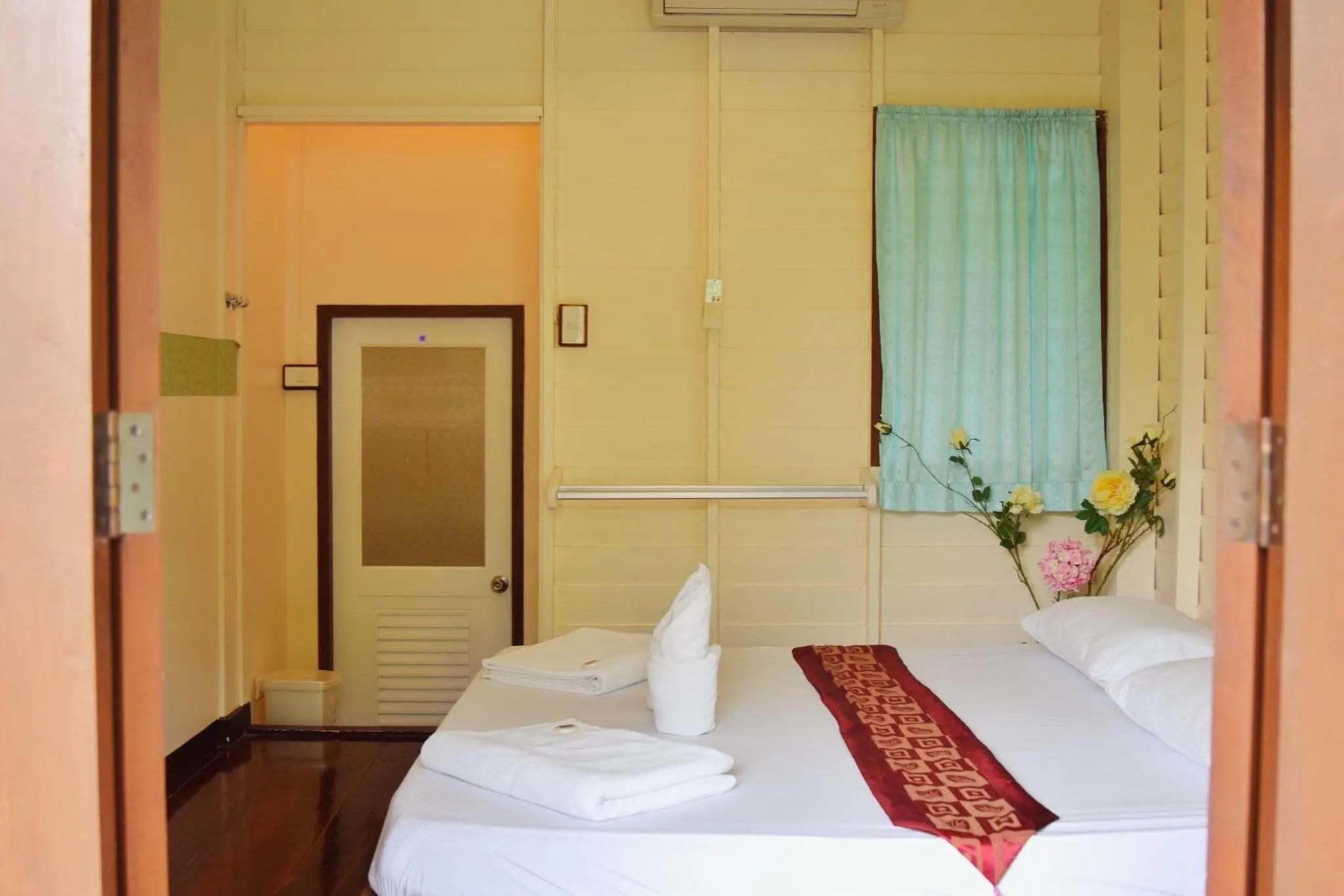 Bed in บ้านกรนรา Baan Kornnara