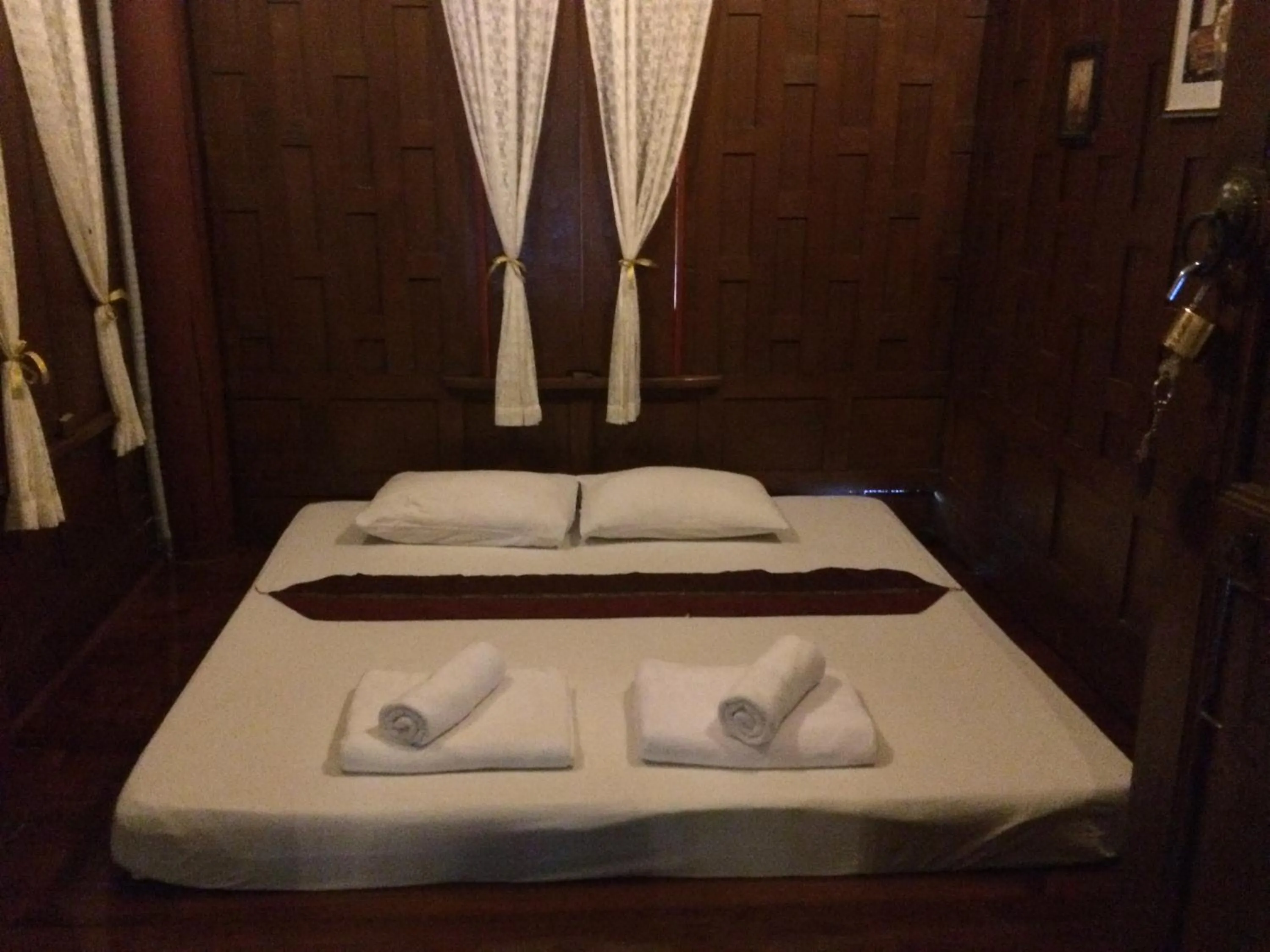 Bed in บ้านกรนรา Baan Kornnara
