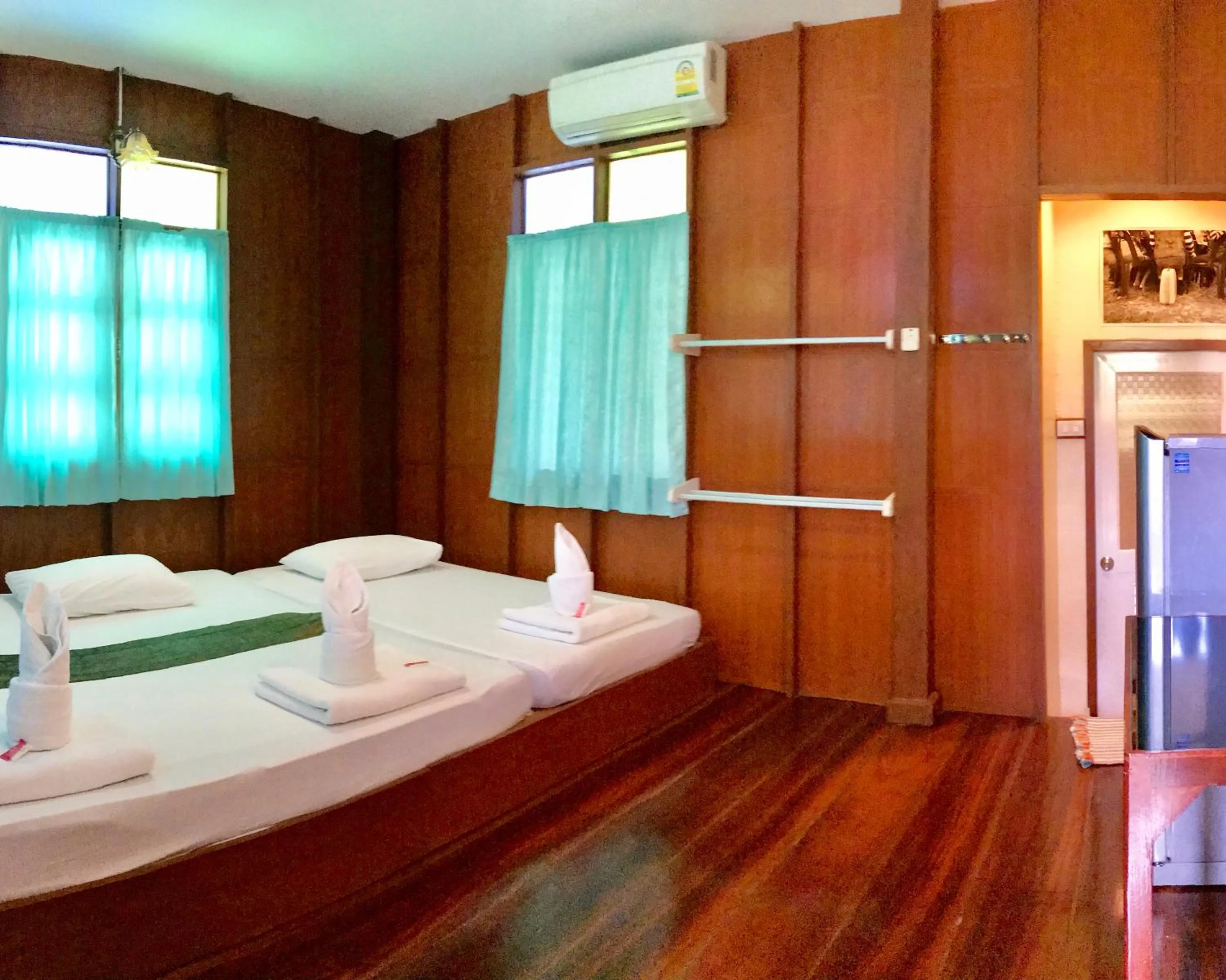 Bed in บ้านกรนรา Baan Kornnara