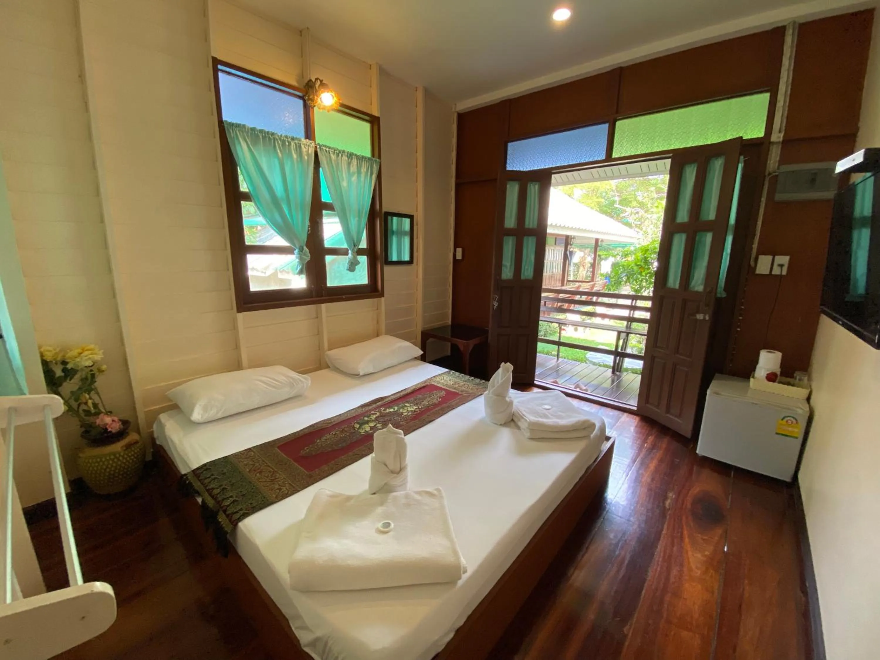 Bed in บ้านกรนรา Baan Kornnara