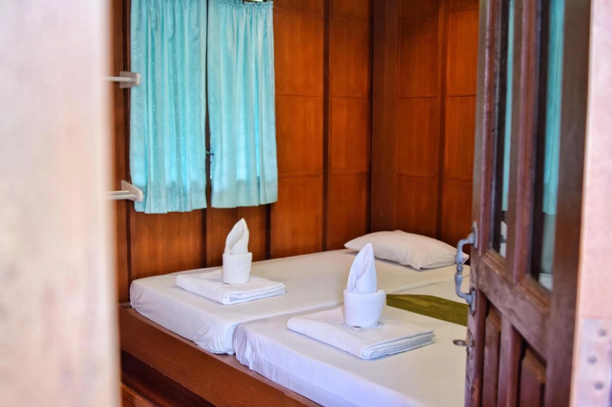 Bed in บ้านกรนรา Baan Kornnara