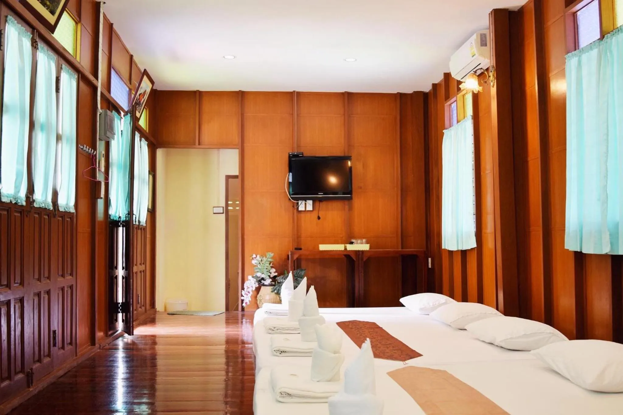 Bed in บ้านกรนรา Baan Kornnara