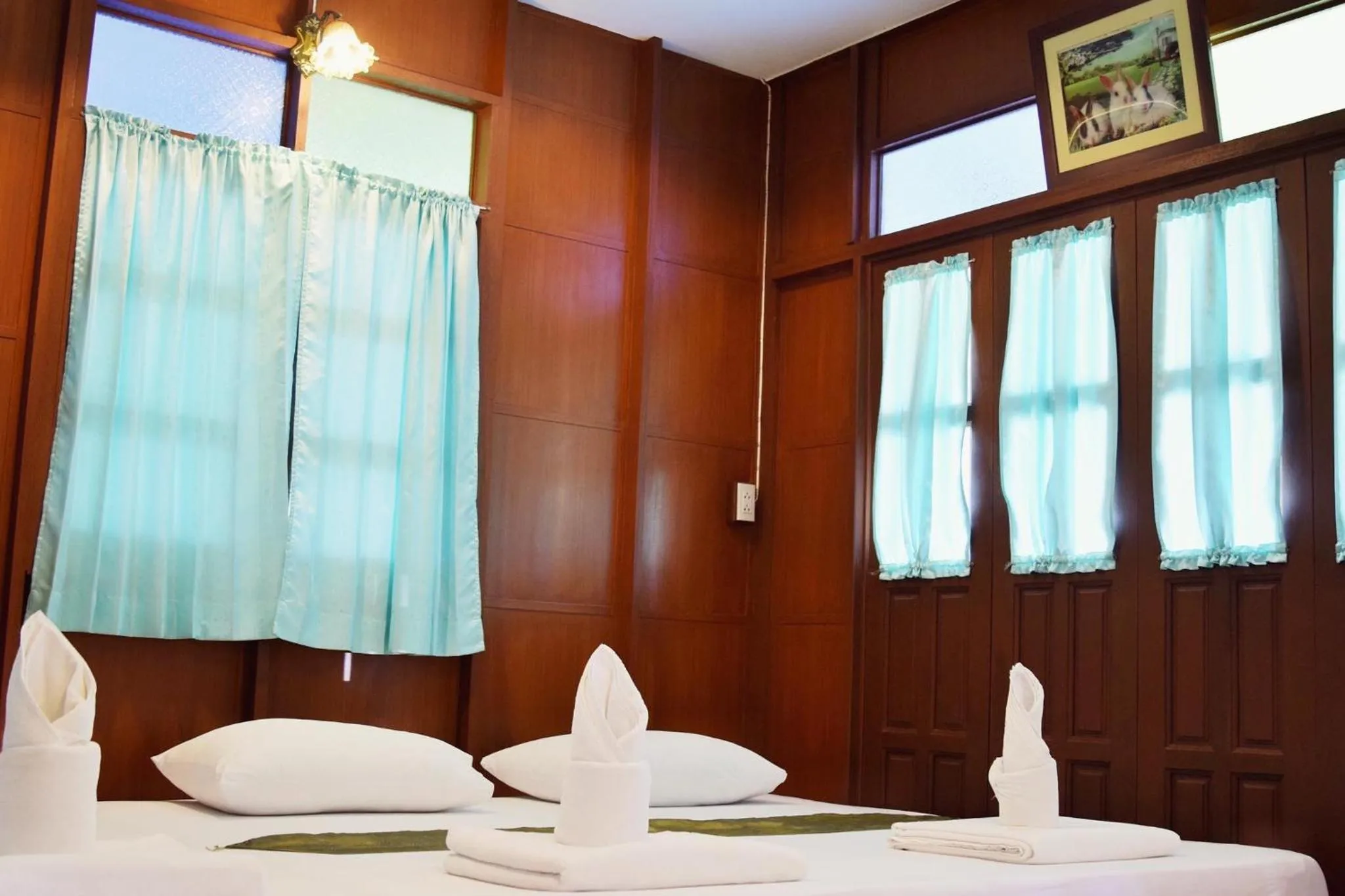 Bed in บ้านกรนรา Baan Kornnara