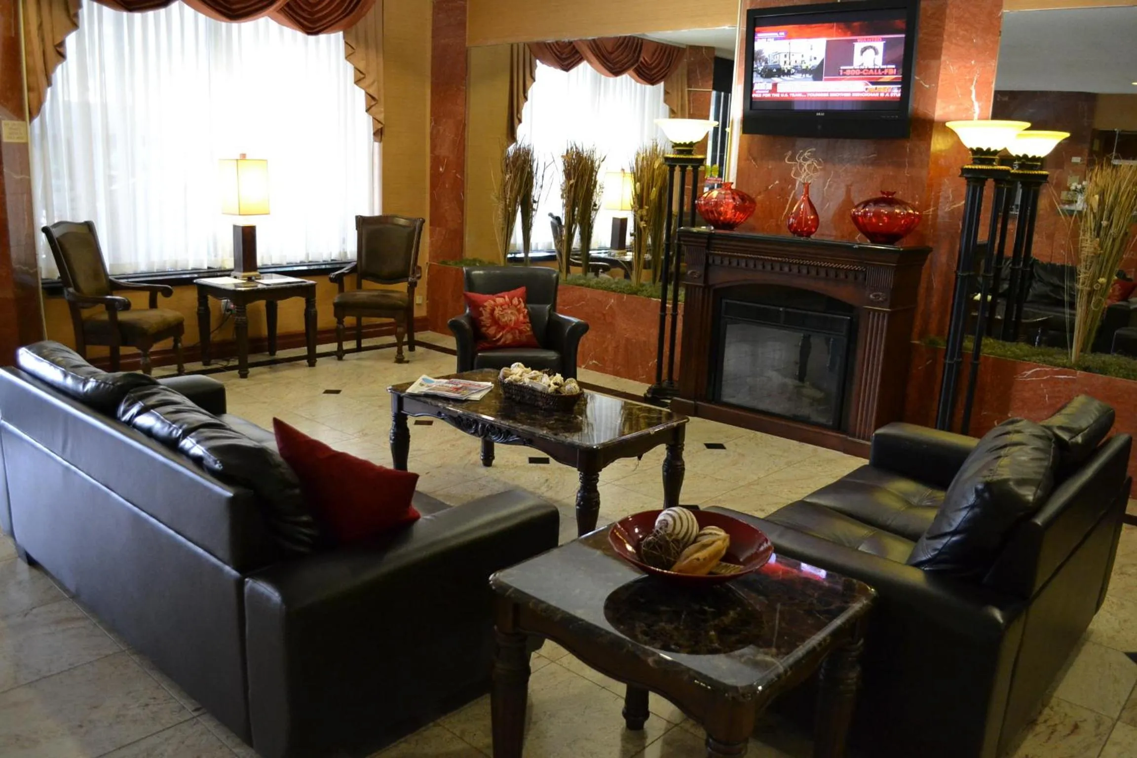 Communal lounge/ TV room in Ramada by Wyndham Newburgh/West Point