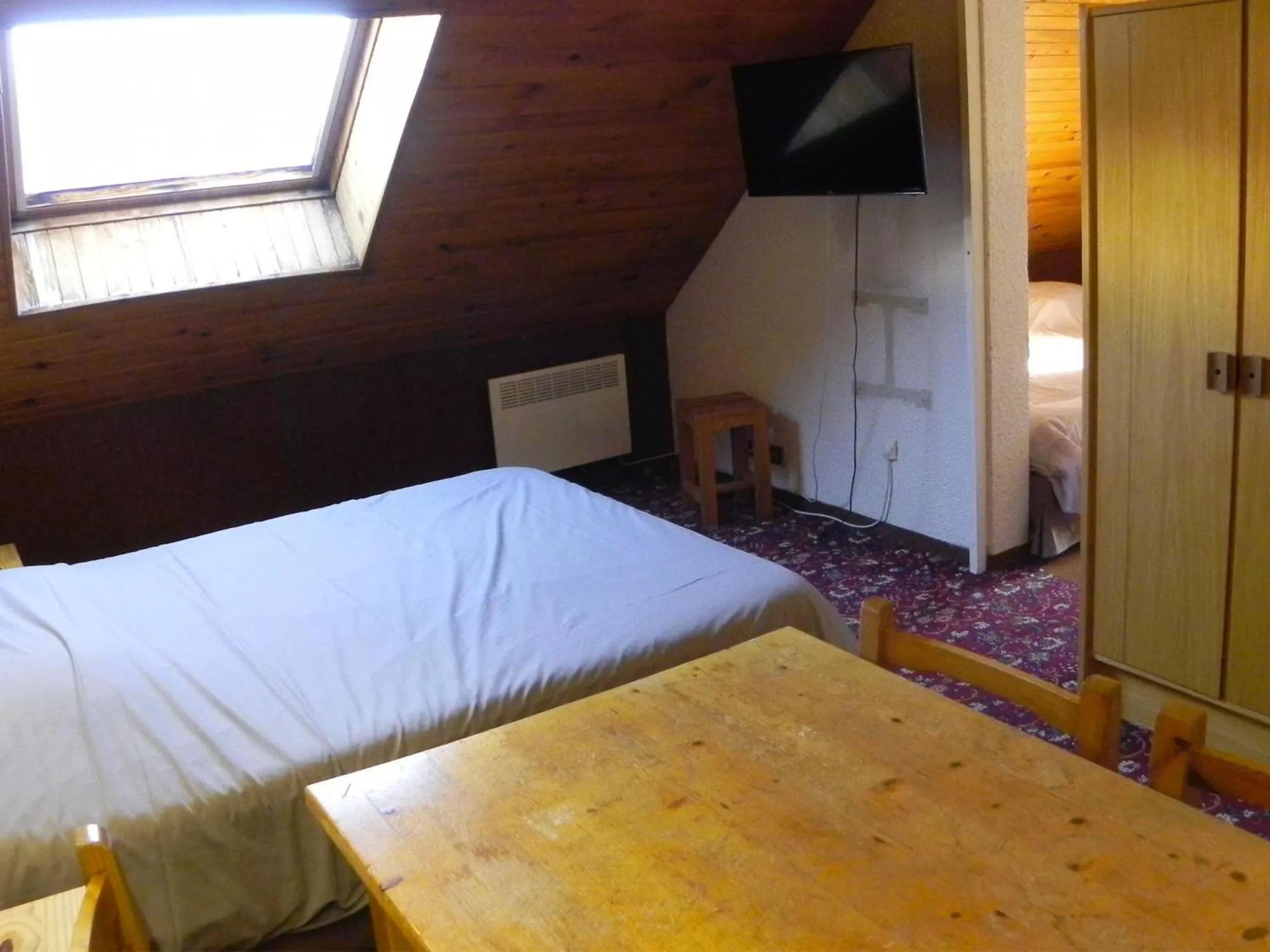 Bed in Hôtel Résidence Les Colchiques