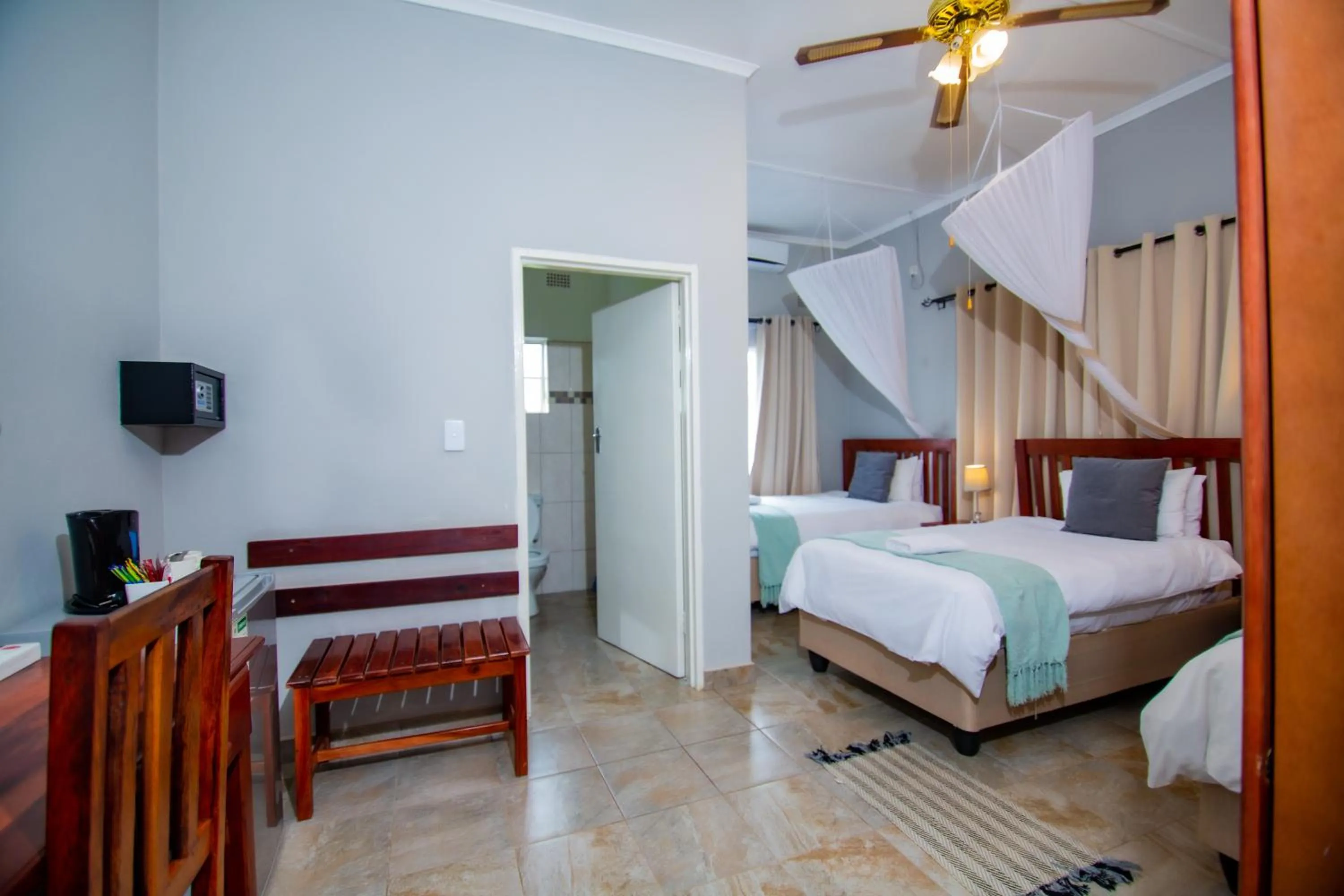 Bed in Dzimbahwe Guest Lodge