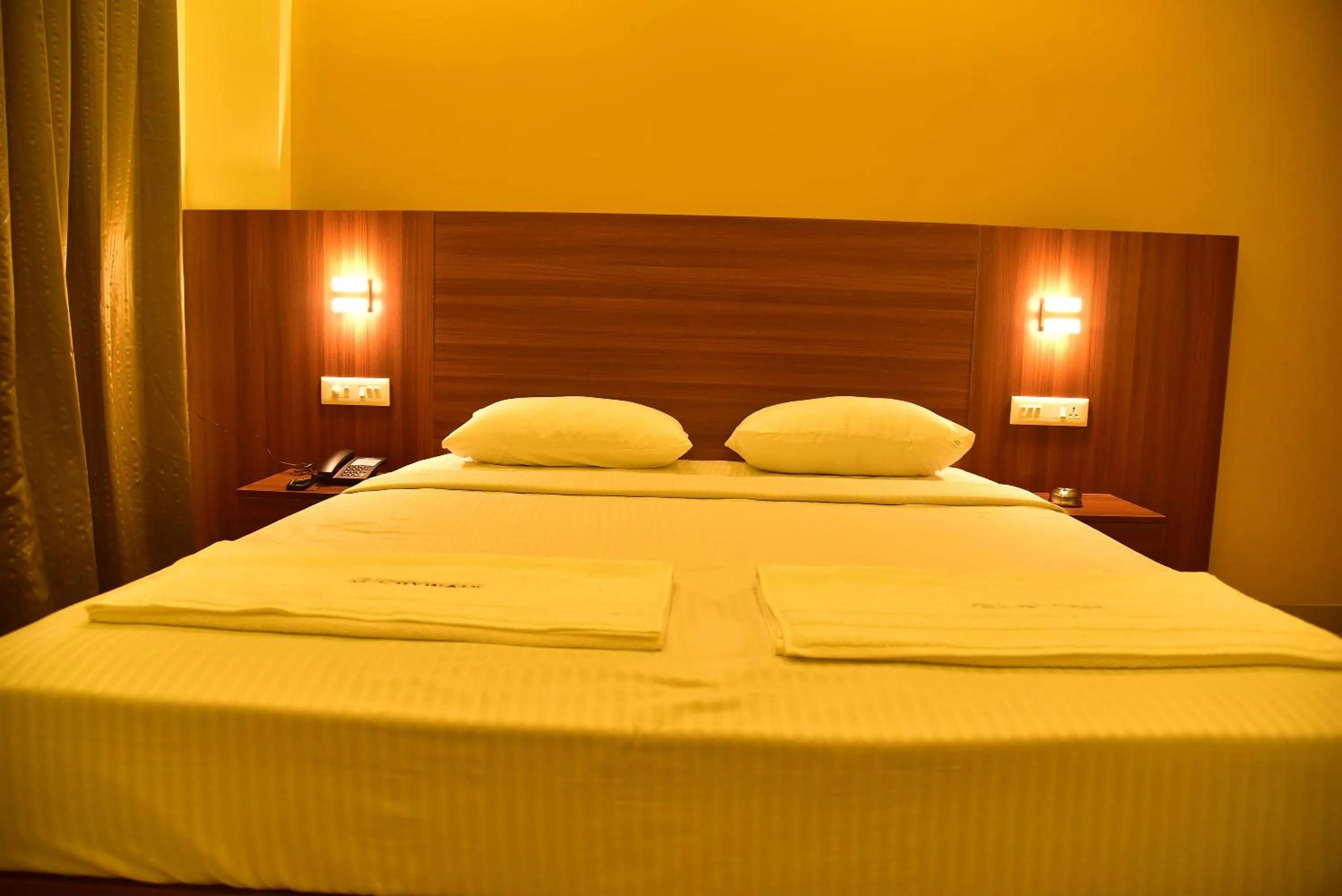 Photo of the whole room, Bed in Hotel Citywalk Residency