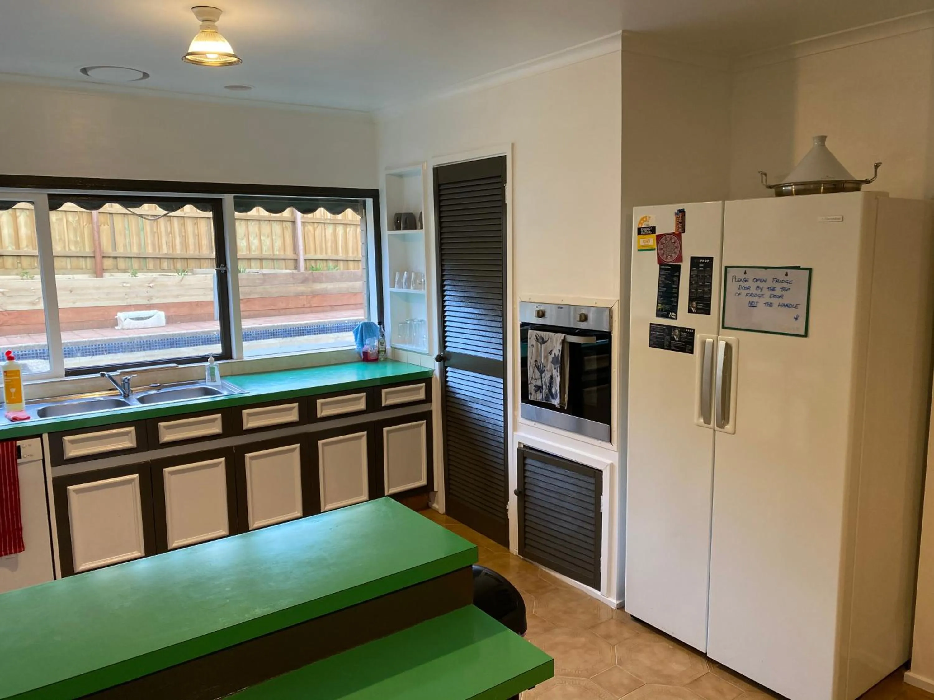 Communal kitchen in ADA Homestay