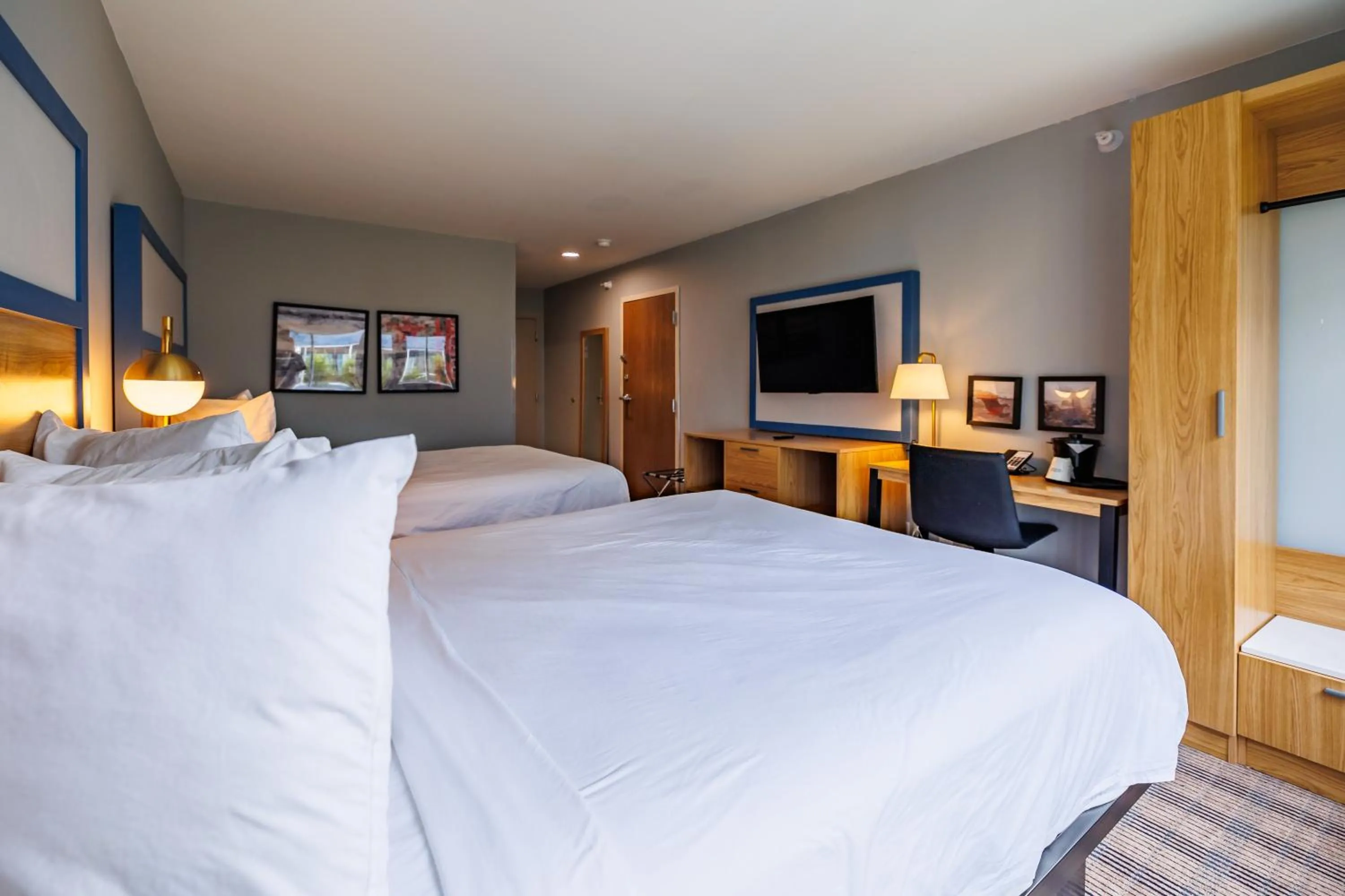 Bed in AmericInn by Wyndham Omaha Near Zoo