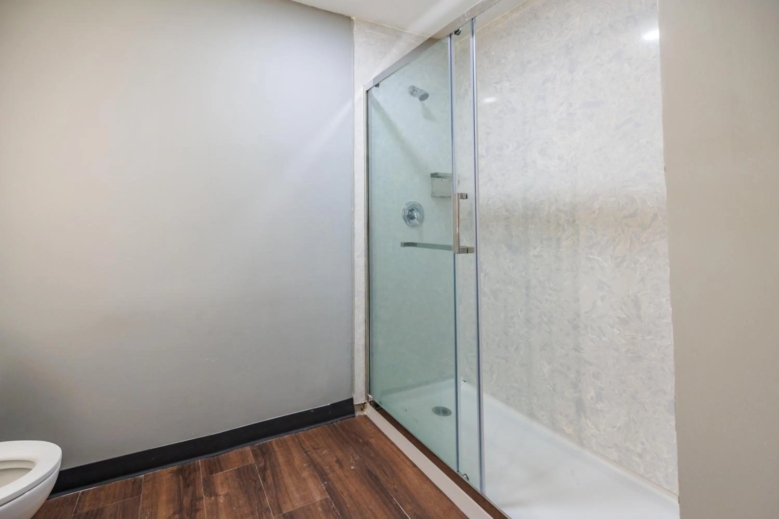 Shower in AmericInn by Wyndham Omaha Near Zoo