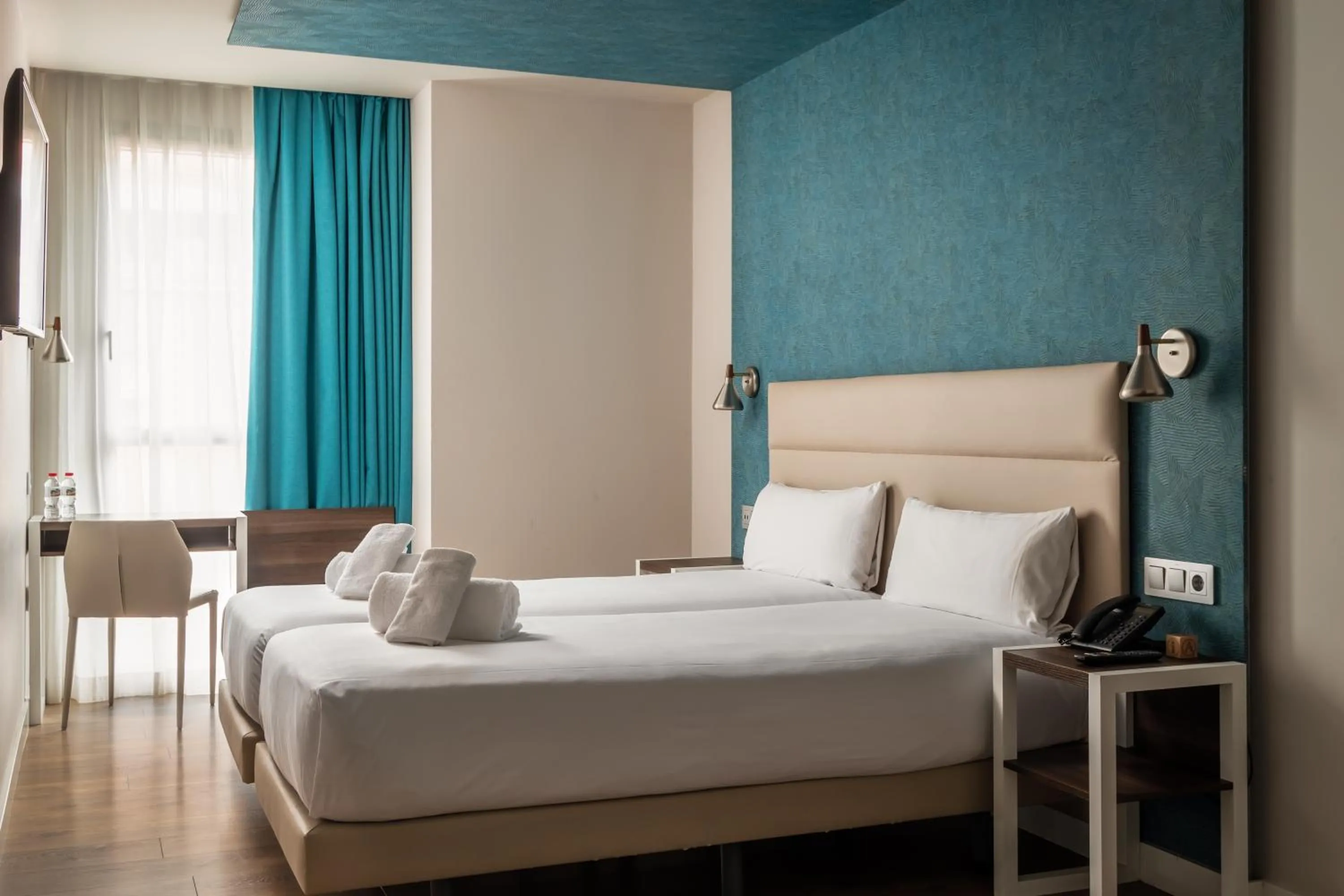 Bed in Arya Stadium Hotel