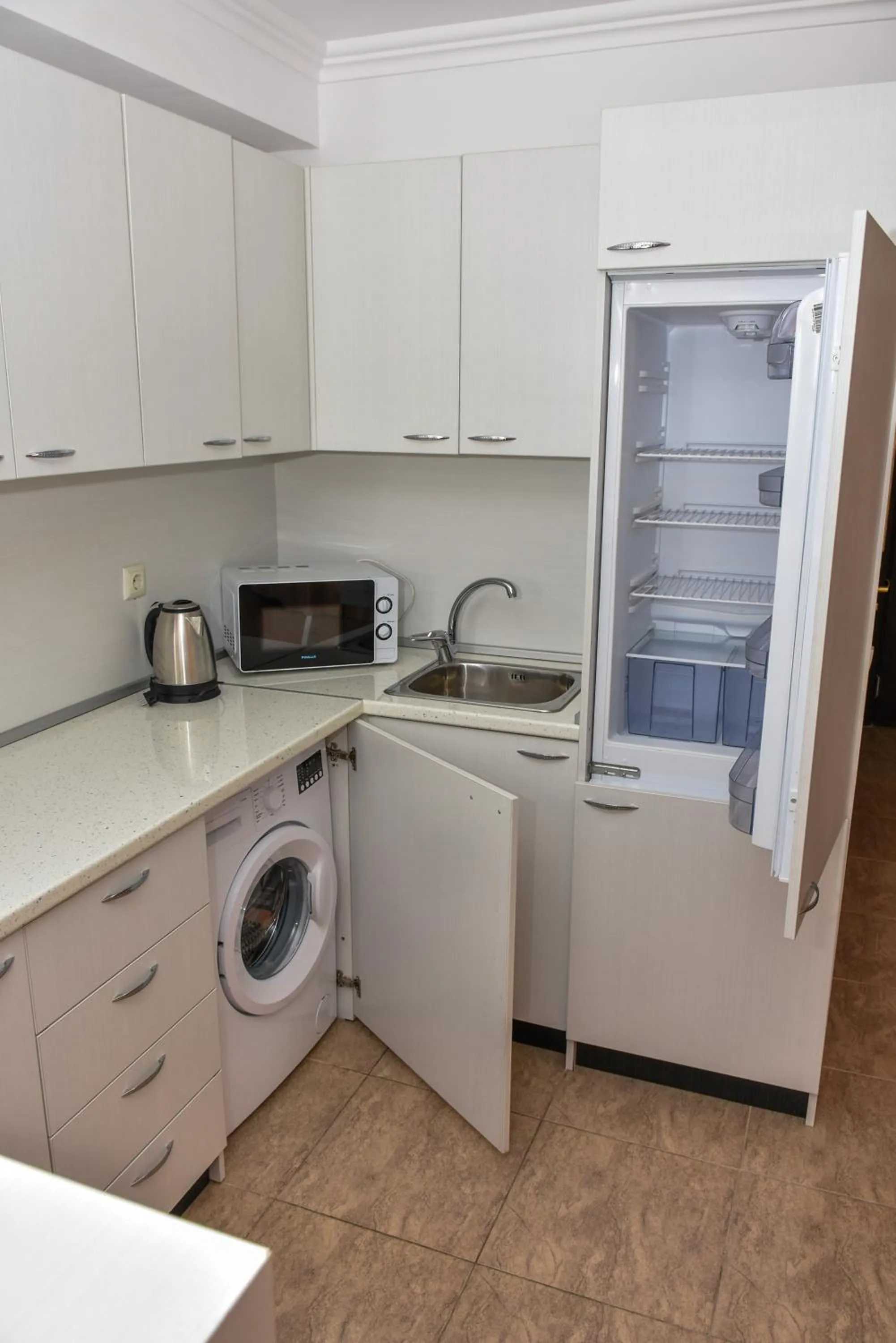 Kitchen or kitchenette in OLYMP Apart-Complex