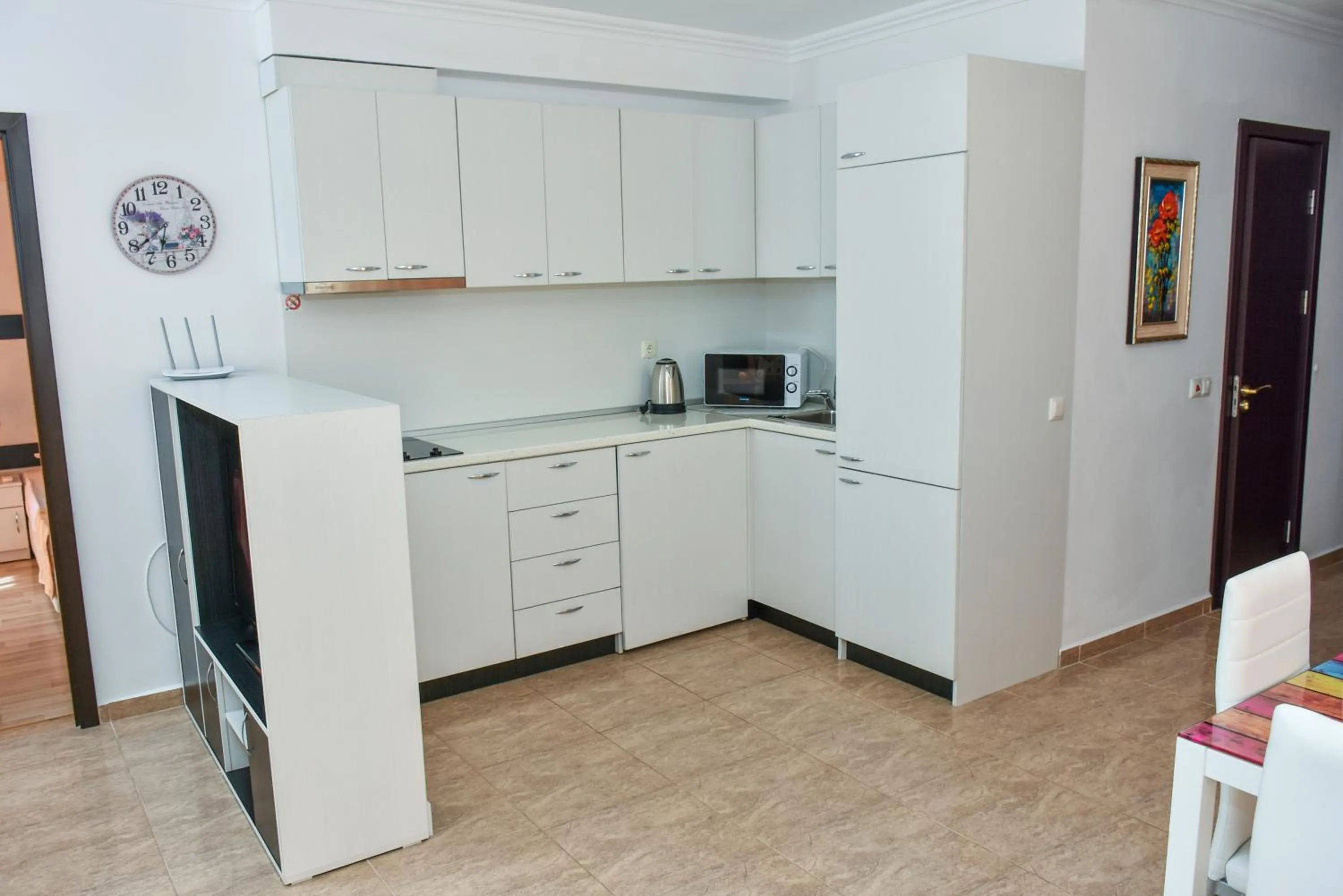 Kitchen or kitchenette in OLYMP Apart-Complex