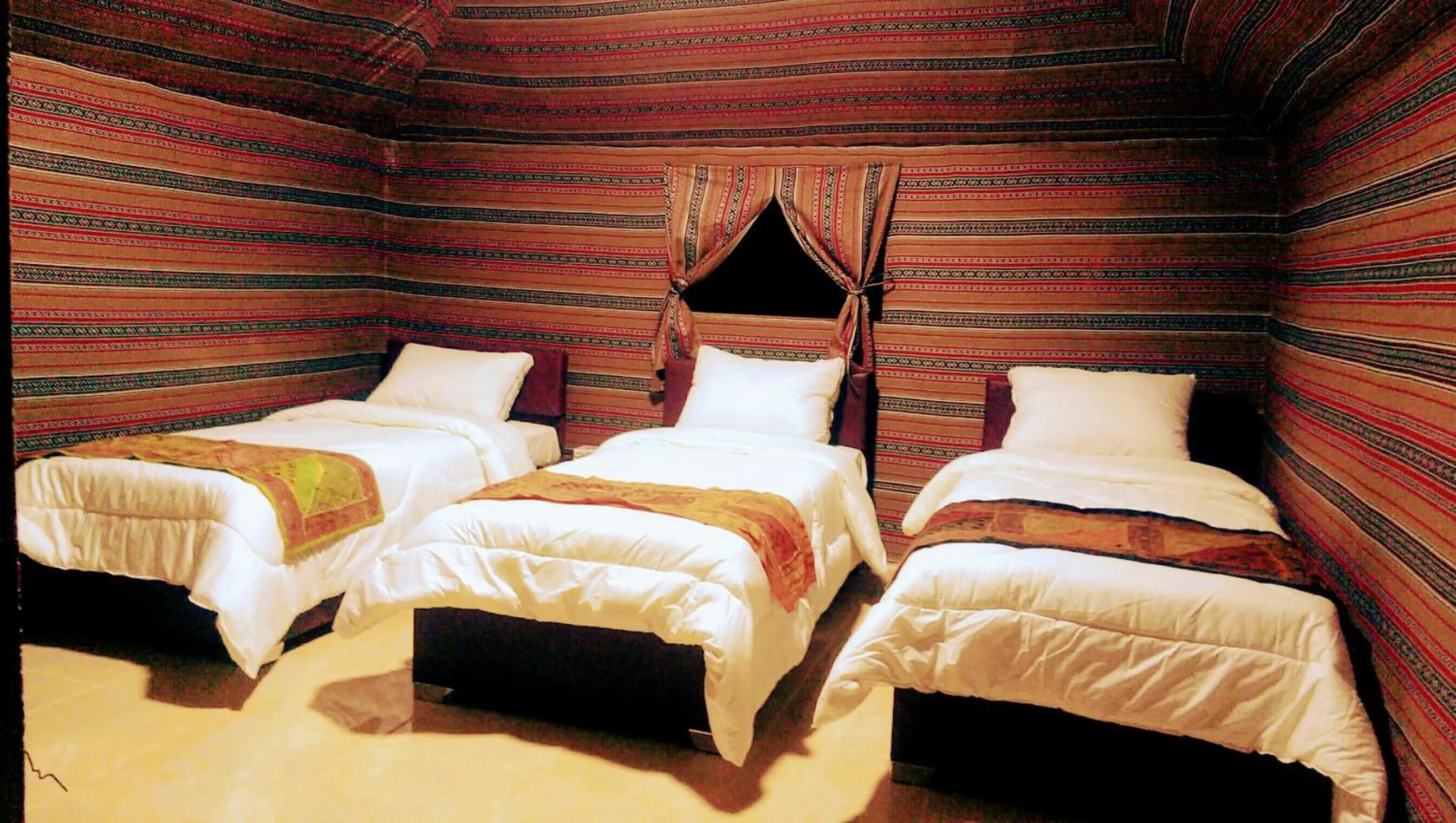 Bed in Beyond Wadi Rum Camp